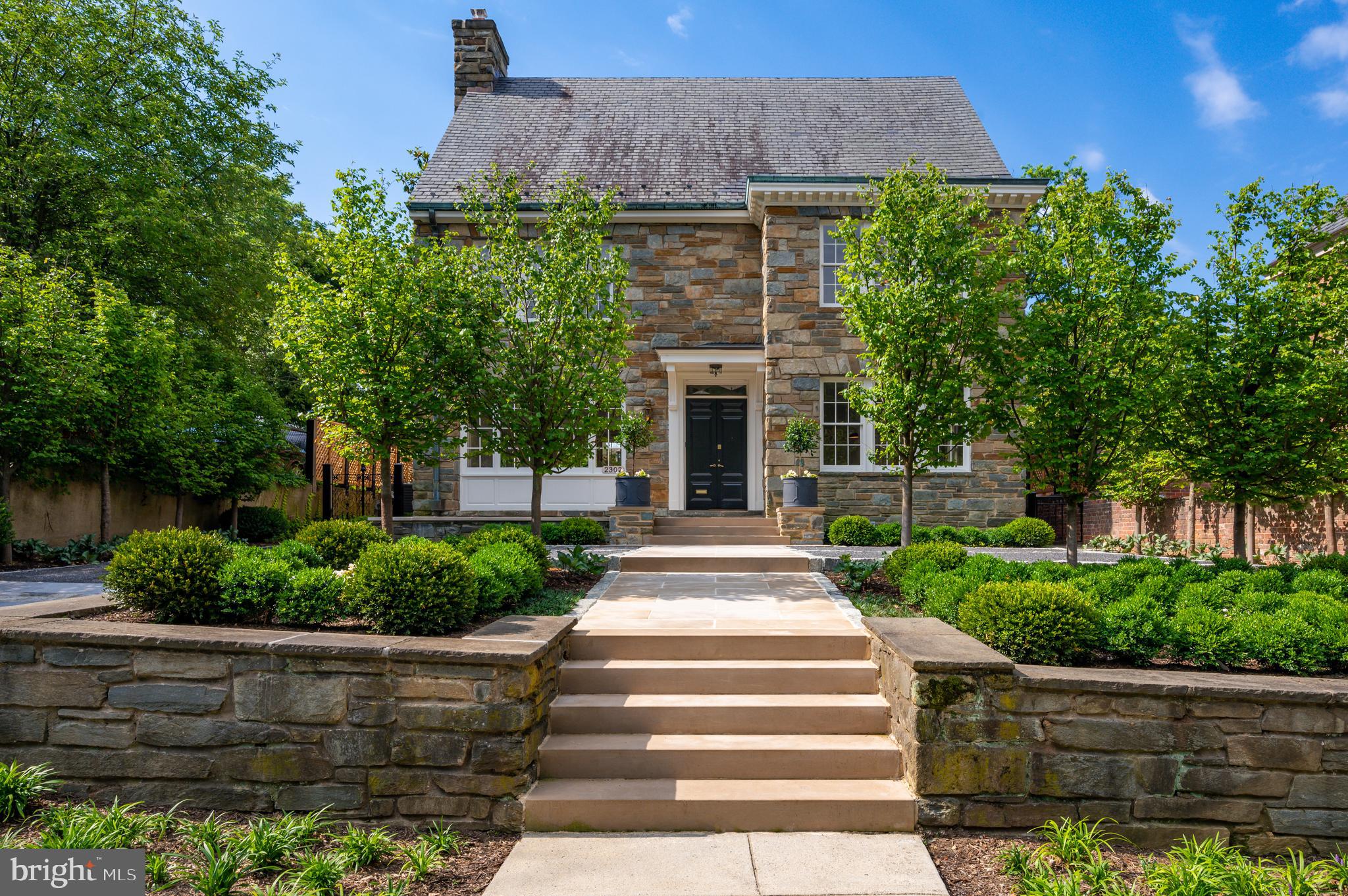 Located in the historical neighborhood of Kalorama; this detached stone 6BR/6.5BA home occupies a premium lot with landscape design by renowned landscape architect Ben Page. The residence has been completely renovated - architect Christian Zapatka - and original features have been artfully restored. The grand main level entry with marble vestibule, white oak floors, powder room, and coat closet serves all areas creating fantastic flow. The bright living room spans the entire length of the house and boasts intricate crown mouldings and original marble fireplace and Venetian mirror. The formal dining room connects to the kitchen through a butler's pantry with calacatta gold marble counters and tiled wall,  additional Bosch dishwasher, and 48" SubZero custom quilted paneled refrigerator/freezer. The eat-in gourmet kitchen features an 8-burner double oven Wolf gas range, Bosch dishwasher, and calacatta gold counters with bar seating for four. The second and third levels of the home feature 5 bedrooms and 5 baths and are accessed by a beautiful curved stair with original brass and metal railing. All bedrooms have en-suite Waterworks baths with Italian carrara marble and heated floors. The lower level contains a 6th bedroom with separate access and 6th full bath, family room, wet bar with a third Bosch dishwasher and SubZero wine/refrigerator/freezer, and large laundry room with island and XL Electrolux washer/dryer. The rear terrace and garden is accessed through 3 sets of french doors on the back of the home. The granite parking court and driveway allows for off-street parking for 4 cars. Vivint security system w/ outdoor HD night-vision cameras & interior motion sensors. Walk to DuPont, Georgetown, Adams Morgan.