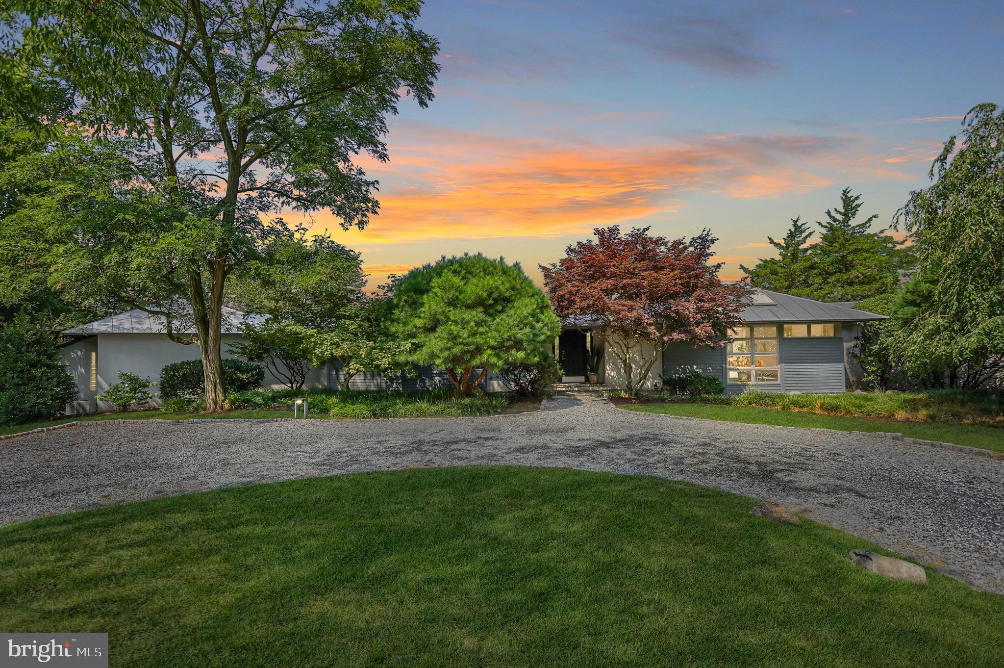 Welcome to your new contemporary oasis.  6993 Schoolhouse road exudes European charm coupled with 20 acres of plush, rolling hillside.  This 5 bedroom, 3.5 bath sprawling ranch-style home was designed by Danish Architect, Christian Hoirup.  This home is comprised of 4 separate wings; primary, kitchen/ family, dining/ entertaining, and children/ guest.  Common wings offer grand cathedral style ceilings, exposed beams, and Spanish inspired tile.  Each wing also accesses the multi-level deck that overlooks the pool area.   This property offers seclusion and various outdoor activities throughout the 20 acre grounds; Hike down to the creek through cleared paths, start a soccer game on the large flat yard, or relax poolside and enjoy the sounds of nature.  This home is truly one of a kind and only minutes from Downton Hershey & Hummelstown, Hershey Medical Center, and Hershey Attractions.  *New Driveway Lighting* Heated, In-Ground Pool* Newer Pool Liner* Newer Salt Water Spa* Professional Landscaping* Hardscape Rock Fountain* New Carpet* New Fixtures* New Well Pump & Water Treatment System* Metal Roof* Deck Restored & Repainted*