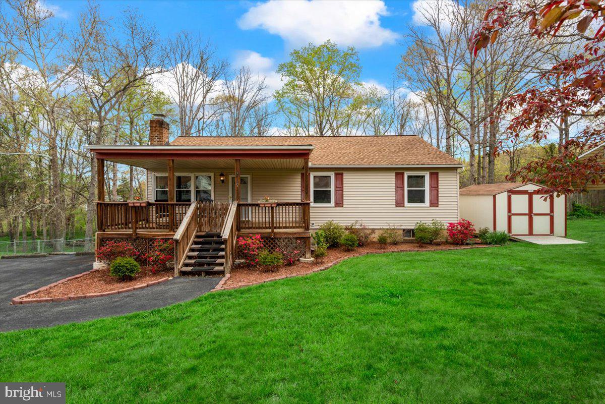 Offer has been verbally agreed on , waiting for relo to sign off!! Welcome to this charming rambler located in North Stafford.  NO HOA. Nearly 2300 finished square feet .  You are greeted by a very welcoming, covered front porch.  Inside are 3 bedrooms & two full baths on the main level.   The kitchen is equipped with all of the necessities as well as a breakfast bar.  Leading out from the dining room is a nice sized deck .  Fourth bedroom/bonus room is located in the finished basement as well as a large family room, wood stove and half bath.  The laundry room is huge and walks out to the FULLY fenced, private,  back yard.  
Updates include Water heater (2020),  Architectural Roof less than 7 years old, Shed (2019), Sump pump (2016), electrical panel and HVAC (2017), Washer and dryer is 5 years old.  The location is prime for shopping, dining, Quantico, Commuter lanes & HOV lanes. **OFFER DEADLINE SAT 4/30 AT 6PM***