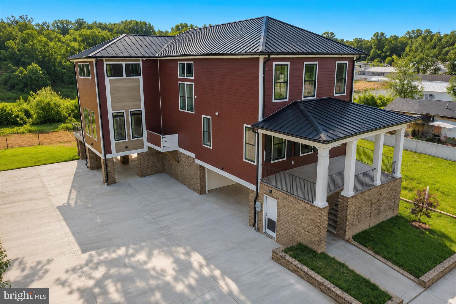 ****$350,000 LESS THAN WHEN ORIGINALLY LISTED.  NOW IS THE TIME TO BUY Waterfront luxury home w/ 3,400+ finished sqft of beauty from end to end! Situated on the banks of the Rappahannock on Sophia Street, a short walk to historic downtown Fredericksburg's plethora of shopping & dining amenities! Enter the massive driveway, multi-car garage & a huge covered patio w/ recessed lighting/optional additional off-street parking! The exterior boasts tremendous character w/ a beautiful standing seam metal roof, hardiplank siding, & custom brickwork on the front & rear! Enjoy an upgraded outdoor relaxation experience w/ a large covered front porch, a massive rear deck & private balcony off the upper-level owner's suite, unobstructed views of the river & historic Chatham Manor perched on the hill! Inside the garage, you will have access to an interior elevator that goes to the upper level! Through the door, you are greeted with/ an abundance of natural lighting from nearly 70 windows providing splendid views virtually anywhere in the home! Off the foyer through a set of French doors sits a large main-level bedroom/optional study w/ a tray ceiling, ceiling fan & recessed lighting, walk-in closet & full bath w/ a frameless shower w/ custom tiling & quartz vanity! Down the hall to the main living area, elegant crown moulding & trim are carried throughout, arriving to the main level elevator access as well as a convenient half bath! On the rear of the home, the extraordinary open floor plan opens up to the breathtaking river views, making indoor entertaining something to look forward to year-round! Magnificent gourmet kitchen is a true chef's delight w/ exquisite quartz countertops & a large center island & breakfast bar, high-end KitchenAid appliances, a double bowl farmhouse sink w/ gourmet faucet, upgraded cabinetry w/ black modern pulls, white subway tile backsplash, w/ a combination of recessed & pendant lighting! Large dining rm w/ plenty of space for dinner parties to come! A fantastic living room completes the main living space w/ a delightful coffered ceiling, recessed lighting & an oversized ceiling fan, in addition to the sliding glass doors to the rear deck & multitude of windows throughout, letting that spring & fall breeze flow through on a sunny day! The crown moulding & custom trim continue from the main-level entry to the upper-level hall, where you will also find the upper-level elevator access & laundry room! Start your day off w/ a view from the owner's suite, stepping out of bed & onto your private balcony looking out over the Rappahannock or from inside w/ the panoramic window views, recessed lighting, dual ceiling fans & a huge walk-in closet with custom, built-in storage! Moving into the luxury ensuite, quartz double vanities, massive walk-in shower w/ frameless glass door, rain shower & separate modern soaking tub, recessed lighting & custom tiling, private water closet & beautiful ceramic tile flooring! Finishing off the upper level, a spacious bonus area & the remaining bedrooms w/ walk-in closets & both w/ attached full baths that boast custom tiling in the shower & ceramic tile flooring! Do not miss this incredibly rare opportunity in downtown Fredericksburg! Some photos are virtually staged.