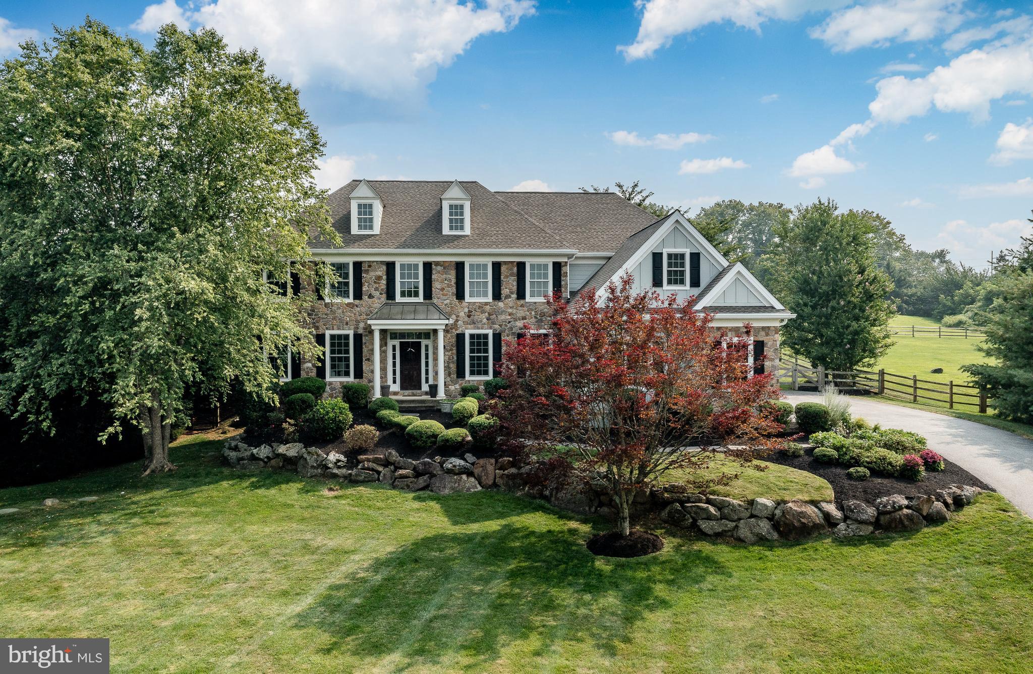 Welcome to 1040 Brick House Farm Lane, an exceptional residence located in one of Newtown Square's most desirable sidewalk communities, complete with scenic walking trails, a tranquil pond, and a neighborhood pavilion for gatherings and community events. Blending timeless design with thoughtfully curated updates, this 4-bedroom, 3 full and 2 half bath home offers refined living inside and out.
The heart of the home is the completely renovated 2025 gourmet kitchen featuring commercial-grade appliances, custom cabinetry, generous workspace, and a beautifully appointed butler's pantry with a built- in coffee station. Designed for both everyday living and effortless entertaining, the kitchen flows seamlessly into the dramatic two-story family room filled with natural light. Spacious formal living and dining rooms provide elegant entertaining spaces, while the private first-floor office with custom built-ins offers an ideal work-from-home setting.
The luxurious primary suite was transformed in 2025 into a true retreat, featuring a spa-inspired bath with an oversized walk-in shower, floor-to-ceiling cabinetry, and an expansive custom walk-in closet. A renovated mudroom adds exceptional functionality with built-in cubbies, shelving, a dedicated workspace with outlets, additional storage, and convenient access to the attached two-car garage.
Upstairs, three generously sized bedrooms are complemented by both a hall bath and a Jack-and-Jill bath, while the upper-level laundry room adds everyday convenience.
The outdoor living space is equally impressive. A newly constructed covered entertaining area extends your living space outdoors and features recessed lighting, a ceiling fan, refrigerator, kegerator, and ample room for dining and relaxing. The hot tub creates the perfect setting to unwind and enjoy the beautifully landscaped backyard throughout the seasons.
Offering extensive 2025 renovations, thoughtfully designed living spaces, and exceptional indoor-outdoor amenities, this home presents a rare opportunity to enjoy luxury living in an established Newtown Square community with convenient access to shopping, dining, parks, and major commuting routes.