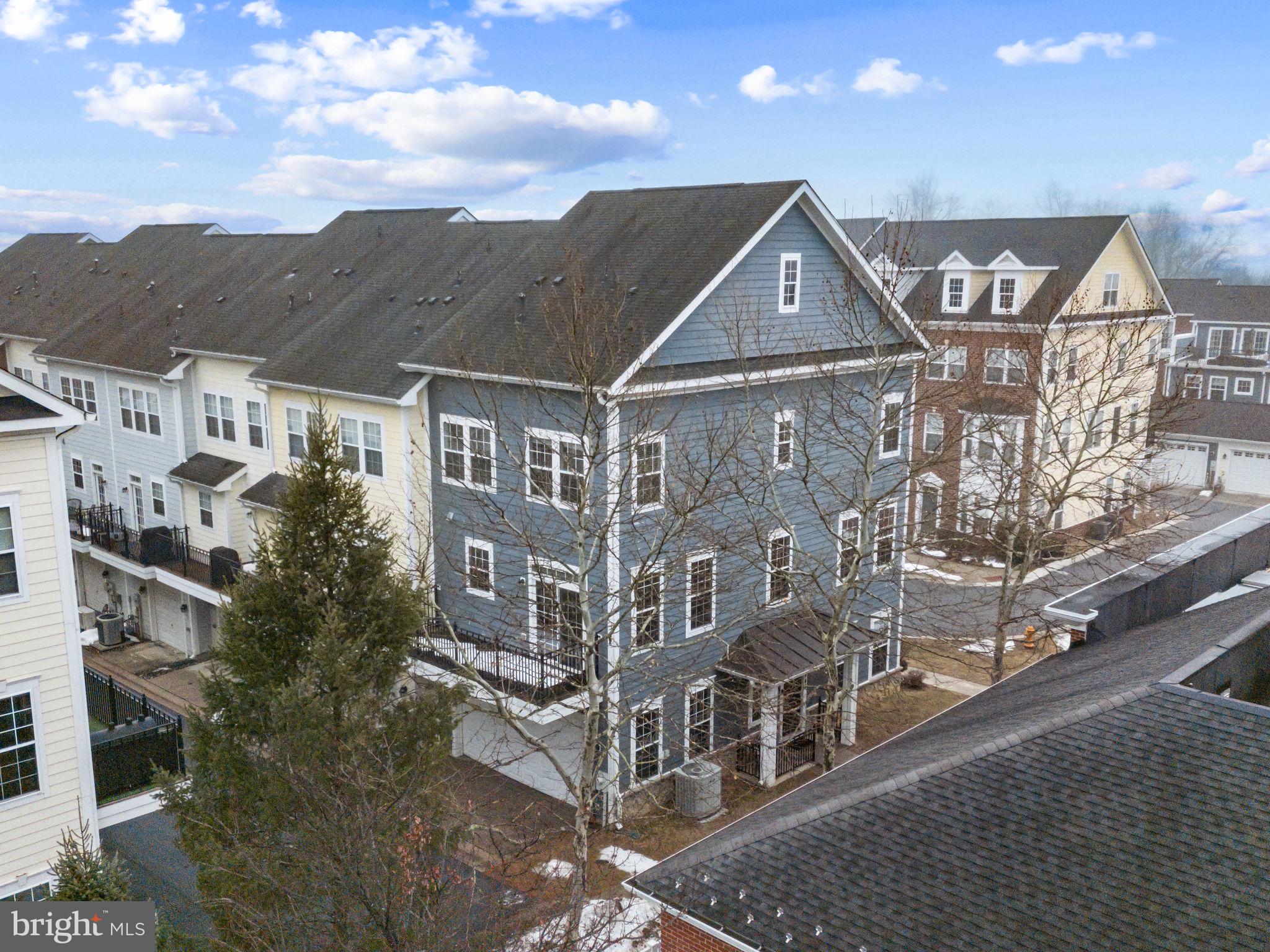 OPEN 1-3:30PM SUN., JUNE 13TH! Incredible value! Located in convenient Shipley's Grant, this grand 2-car garage end-unit townhome is flooded with light, has expansive views, hardwood floors and a newly stained deck! Just a stone's throw from Shipley's Grant Shopping Center with every modern convenience, this elegant domicile is turn-key ready.  The inviting layout offers an open floor plan complete with many different options for today's living; the main entry foyer boasts a recreation room or a combination office-guest room (4th bedroom); there's an oversized 2-car garage with all mechanical systems located in 2 closets inside the garage promoting a quiet living space; there is a private front open porch-patio area and a long deck off the kitchen; gas hot water, gas cooking, gas heat, electric central air conditioning and a gas living room fireplace are all affordable and attractive features.  The kitchen boasts a separate island for both prep work and seating; 42" high wood cabinetry abound with expansive granite counters and designer backsplash, stainless steel appliances and a huge table-space area for your kitchen table. The many large windows, fabulous wall spaces throughout for artwork and sculptures,  and recessed lighting compliment this lovely home.  The king-sized master bedroom sports a large closet, room for large furniture like dressers and desk and includes a master bathroom complete with garden tub, shower with large shower head, and tall dual vanity sinks, designer mirror and medicine chest.   The first 2 levels include hardwood and bamboo flooring while the bedroom level has new carpeting throughout.  An added highlight is the Samsung practically new washer and dryer conveniently located on the bedroom level.  residents enjoy a walkable community atmosphere with amenities including a fitness center and club house, outdoor pool, party room and bike and jogging trails. Easy access and less than 5 minutes commute to I-95, Route 100, and Route 1;  shopping, dining, and everyday conveniences enhance the amenity-rich lifestyle.