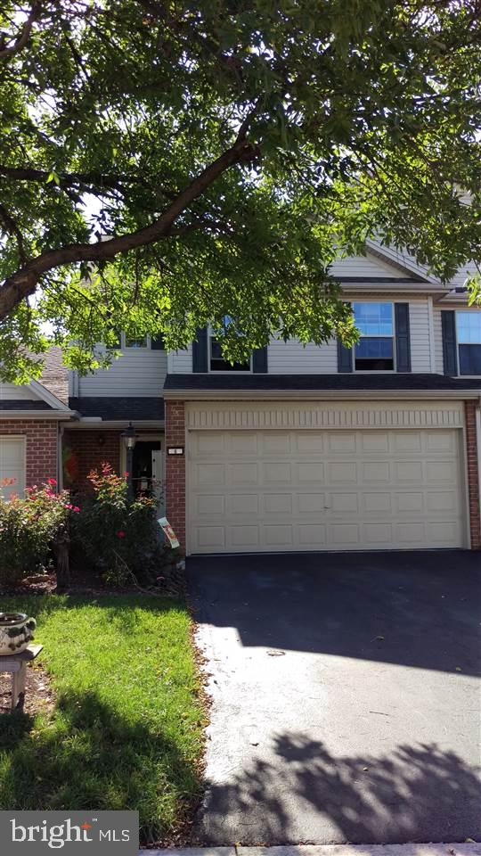 You'll fall in love with this immaculate 2 story townhome in Sherwood Court. Beautiful hardwood floors throughout. Enjoy morning coffee on the deck, view sunsets from the year round use of sunroom. Kitchen boasts cherry cabinets, new tile flooring, eat at bar; upstairs hall with wood floors is large enough for a separate office area. Recent upgrades: HVAC system, front door, storm door, hot water heater, garage door opener, keyless entry. Assoc. includes grass cutting, mulch, snow removal, bush trimming.