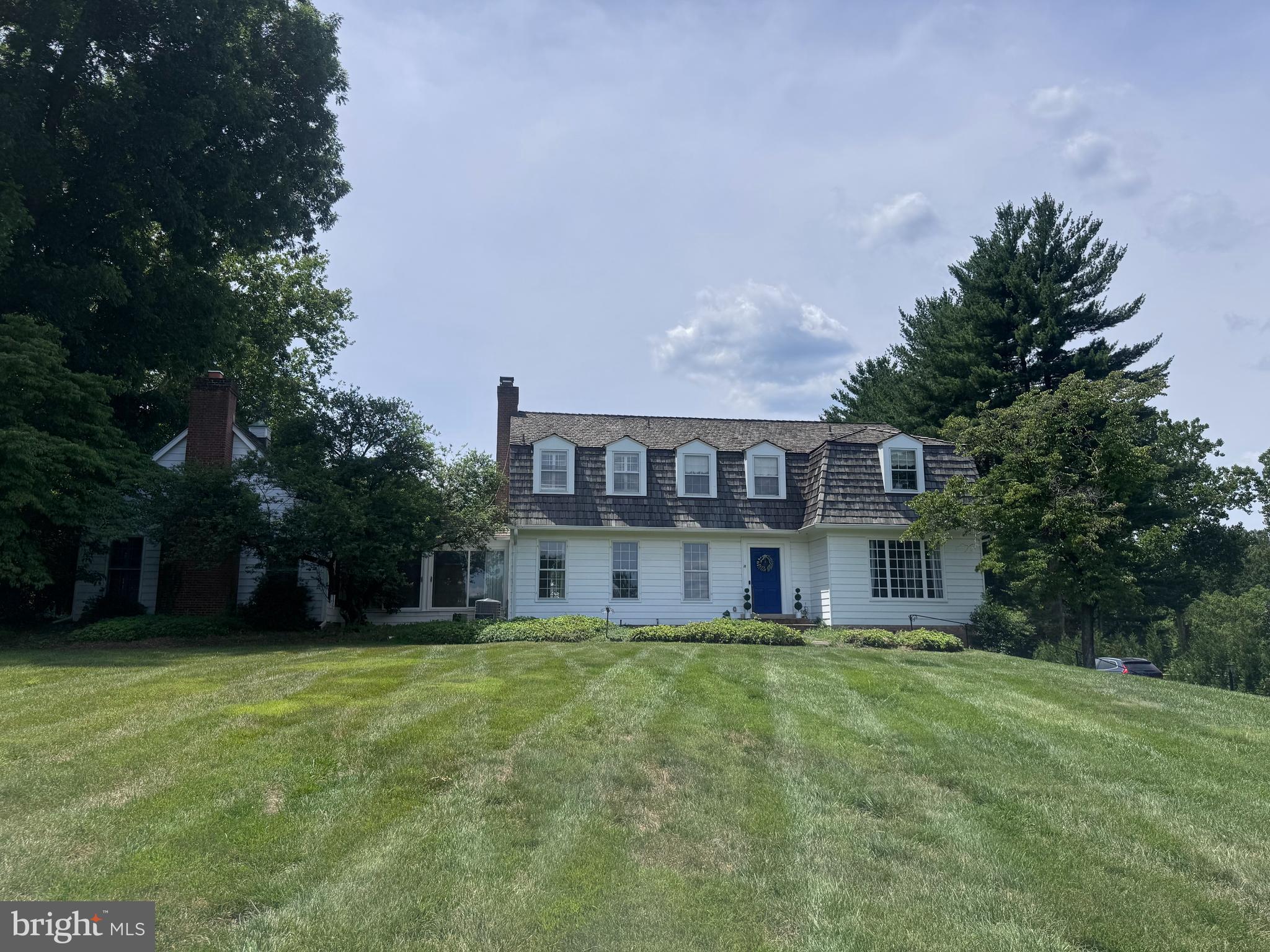 New Listing in fabulous Potomac Falls! A rare 2.3-acre lot in the heart of the neighborhood, on a quiet street in one of the area's most prestigious neighborhoods with rolling hills, mature trees, and complete privacy. A wonderful opportunity to move in and renovate over time, or design and build new. Existing center hall Dutch Colonial (4,170 sq ft, 4BR/4BA + 2 Half baths) has been held by the same family for over 40 years, with 2-car attached and 2-car detached garages and a 40' x 25' pool! Roof (2018), HVAC main handler (2025), French drain/sump pump (2023), and pool resurface (2025) are recent updates — meaningful systems already addressed for a buyer who wants to live in the home while making it their own. A setting like this rarely comes to market. Conveys in As-Is condition. You don't want to miss this one!