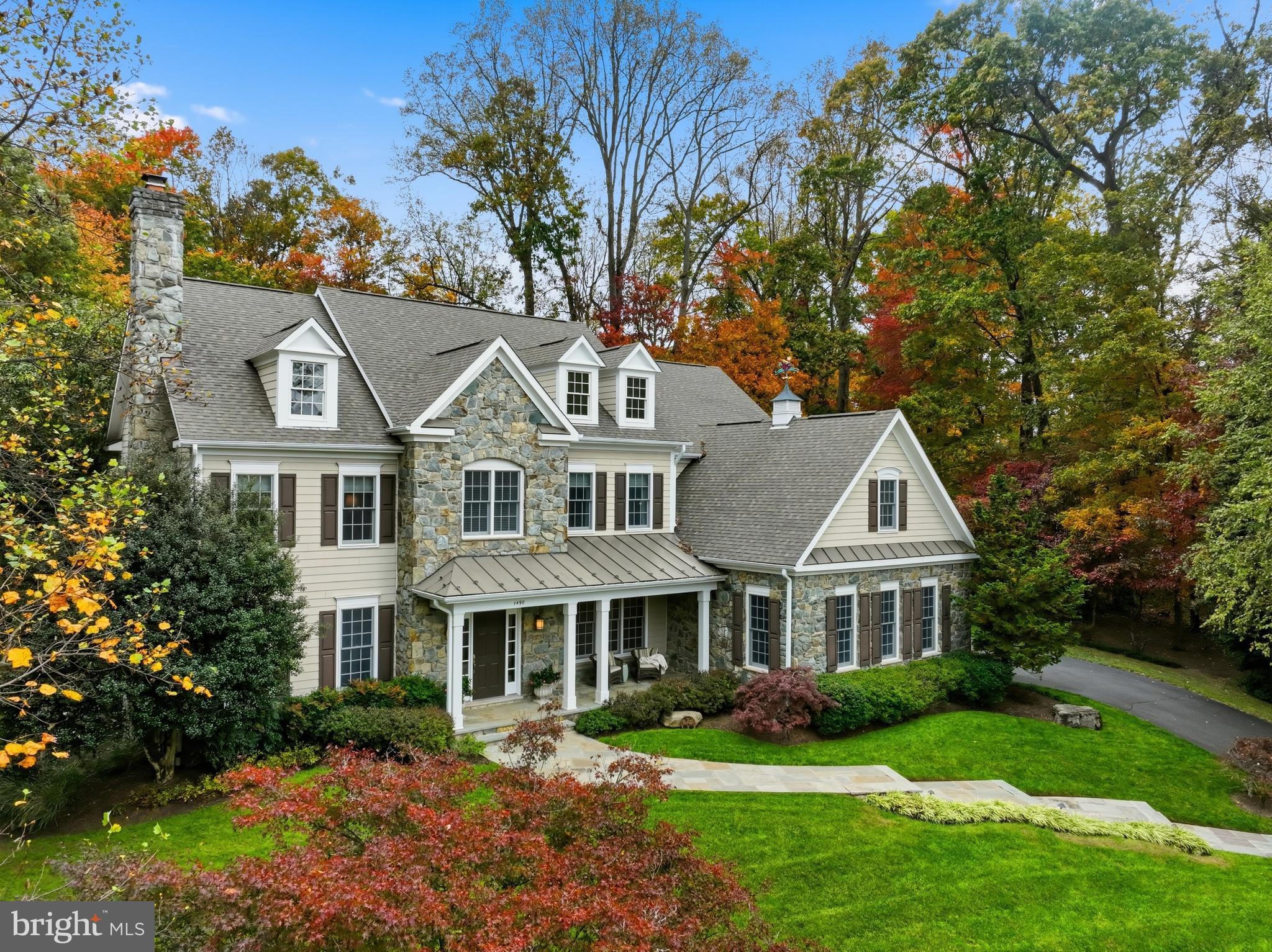 Exceptional New Listing!  This custom built home, in the sought-after Fox Run community, is perfectly sited on a quiet cul-de-sac on nearly an acre. With 5 bedrooms, 4 full baths, 2 half baths, and more than $950,000+ in custom enhancements, this home is a true expression of timeless design, superior craftsmanship, and enduring quality.  Highlights include 10' ceilings on the main level,  designer lighting, detailed millwork and moldings,  stained-in-place oak hardwoods, and two fireplaces. The chef’s kitchen features high-end appliances, custom cabinetry, and a large center island, opening to a spacious family room and an impressive screened porch on the main level with stone/gas fireplace, coffered ceiling, TimberTech flooring, and remote-controlled shades creating seamless indoor-outdoor living. The luxurious primary suite offers a spa-like bath with heated marble floors and dual walk-in closets.  The finished lower level offers a   spacious rec room with custom built-ins, a wet bar, bedroom and full bath, craft/studio space, and walk-up exit.  Outdoor amenities include a flagstone patio, outdoor kitchen, firepit,  a lovely pond & waterfall, and wooded privacy. An added bonus includes an oversized 3-car, side load garage with 3 9 foot doors.   Top Langley pyramid schools. A rare offering in Great Falls.