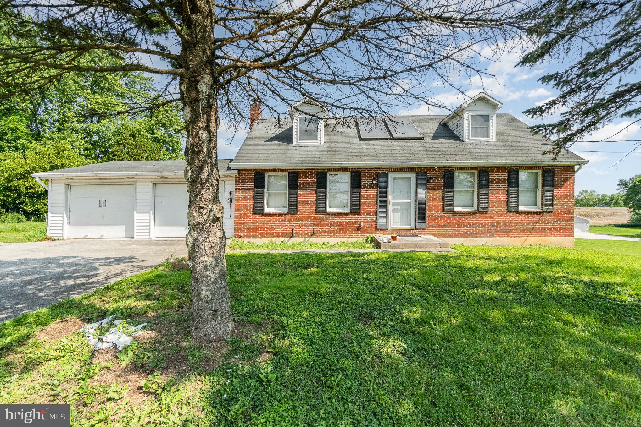 Discover the potential of this unique 29.47-acre farmette featuring a classic brick Cape Cod home nestled in the scenic countryside of Silver Spring Township in Cumberland Valley School District. Offering 3 bedrooms and 2 full baths, this home is full of character and ready for your personal touch.  With a bit of TLC, it could be transformed into a stunning private estate.  Enjoy additional living space with a walk-out lower level that includes a finished game room, plus a cozy sunroom at the back of the home—perfect for relaxing while taking in peaceful views of your land.  A rare bonus: the home is equipped with natural gas heat, uncommon for properties of this size.  The property is enrolled in Clean & Green, keeping your real estate taxes low, and is zoned Rural Residential, offering flexible use and plenty of possibilities.  A large detached pole barn provides ample space for equipment, storage, or hobby use.  Currently, a local farmer rents and farms the land, creating a low-maintenance income opportunity.  With its generous acreage, existing infrastructure, and idyllic setting, this property is ideal for someone looking to create a private retreat, hobby farm, or investment property.  So much potential—don’t miss this chance to make it your own!