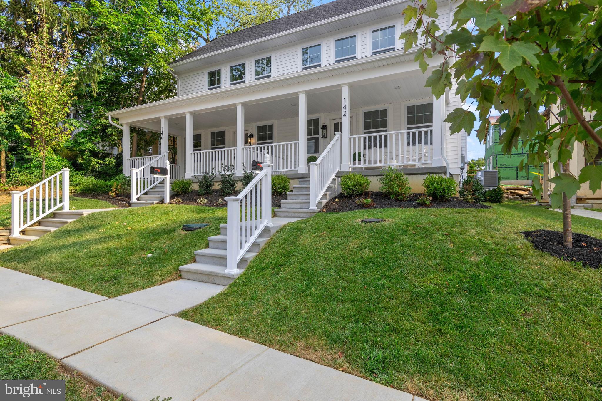 Newly Built in Narberth Borough – All New, Walkable, Move-In Ready
142 Merion Avenue presents a rare opportunity to own brand-new construction in the heart of Narberth, crafted by Craft Custom Homes as part of a thoughtfully planned five-residence project. This property has been reimagined to include two striking twins, two single cottages (one already sold), and the original home, relocated on the parcel and currently undergoing full renovation. Backed by more than 20 years of experience, Craft’s multigenerational team is known for delivering exceptional quality and design from concept to completion.
Set on a quiet, tree-lined, walkable street with sidewalks, the neighborhood is vibrant, with many homes undergoing stylish renovations and improvements. Merion Ave’s curb appeal is undeniable, with landscaped grounds, crisp white siding, and a welcoming covered front porch—perfect for morning coffee or simply enjoying the activity of the block.
Offering 3,440 finished square feet across four levels (2,521 sq. ft.  above grade + 919 sq. ft. lower level), with 4 bedrooms, 3 full baths, and 2 half baths. The interiors are entirely new, showcasing light oak hardwood flooring, sophisticated fixtures, and a bright, thoughtfully designed floor plan that blends modern comfort with timeless style.
The main level is designed for both entertaining and everyday living. From the covered front porch entry, light white oak hardwood floors flow through the expansive family room, the dining room with a triple window, and the sunlit gourmet kitchen. The kitchen features white and light wood cabinetry, a quartz center island with seating for four, tile backsplash, and premium stainless-steel appliances from Kieffers, including a GE 30” Smart Range, wall-mounted hood, and 24” dishwasher. A nearby walk-in pantry and stylish powder room add convenience, while a door off the kitchen opens to the rear patio—ideal for grilling or dining outside. Beautiful, modern light fixtures throughout the home provide a refined finishing touch to this level.
The second floor features a primary suite highlighted by a large bay window and two generous closets, including a walk-in. The luxurious en-suite bath offers a double sink vanity, wide-format tile flooring, a spacious glass-enclosed shower with striking tile work, and a separate water closet. Bedroom 2 is also on this level and includes its own stylish full bath with shower/tub and walk-in closet. A conveniently placed laundry room , along with a large hall closet, adds everyday function.
The third floor includes two additional bedrooms, one featuring a charming window seat, along with a full hall bath with tub/shower. The third level also offers a large open room with windows and a desk area—an ideal setting for a home office or study nook.
The finished lower level adds incredible versatility, featuring a spacious bonus room, a powder room, and plenty of room for media, play, fitness, or hobbies.
Lifestyle and location are second to none. Just 0.3 miles from the Narberth train station, residents enjoy direct service into Center City. Whole Foods, the beloved Narberth Theater, cafés, boutiques, and everyday conveniences are all within walking distance. Nearby communities—including Bala Cynwyd, Ardmore, Merion, and Bryn Mawr—offer premier dining, shopping, and cultural amenities. Parks such as Merion Botanical Park, Sabine Park, and Narberth Playground provide green space and recreation, while local traditions like the July 4th fireworks and the seasonal farmers’ market foster a true small-town feel.
Situated in the award-winning Lower Merion School District, these homes deliver the rare combination of new construction, refined finishes, and a highly walkable location in one of the Main Line’s most desirable boroughs.