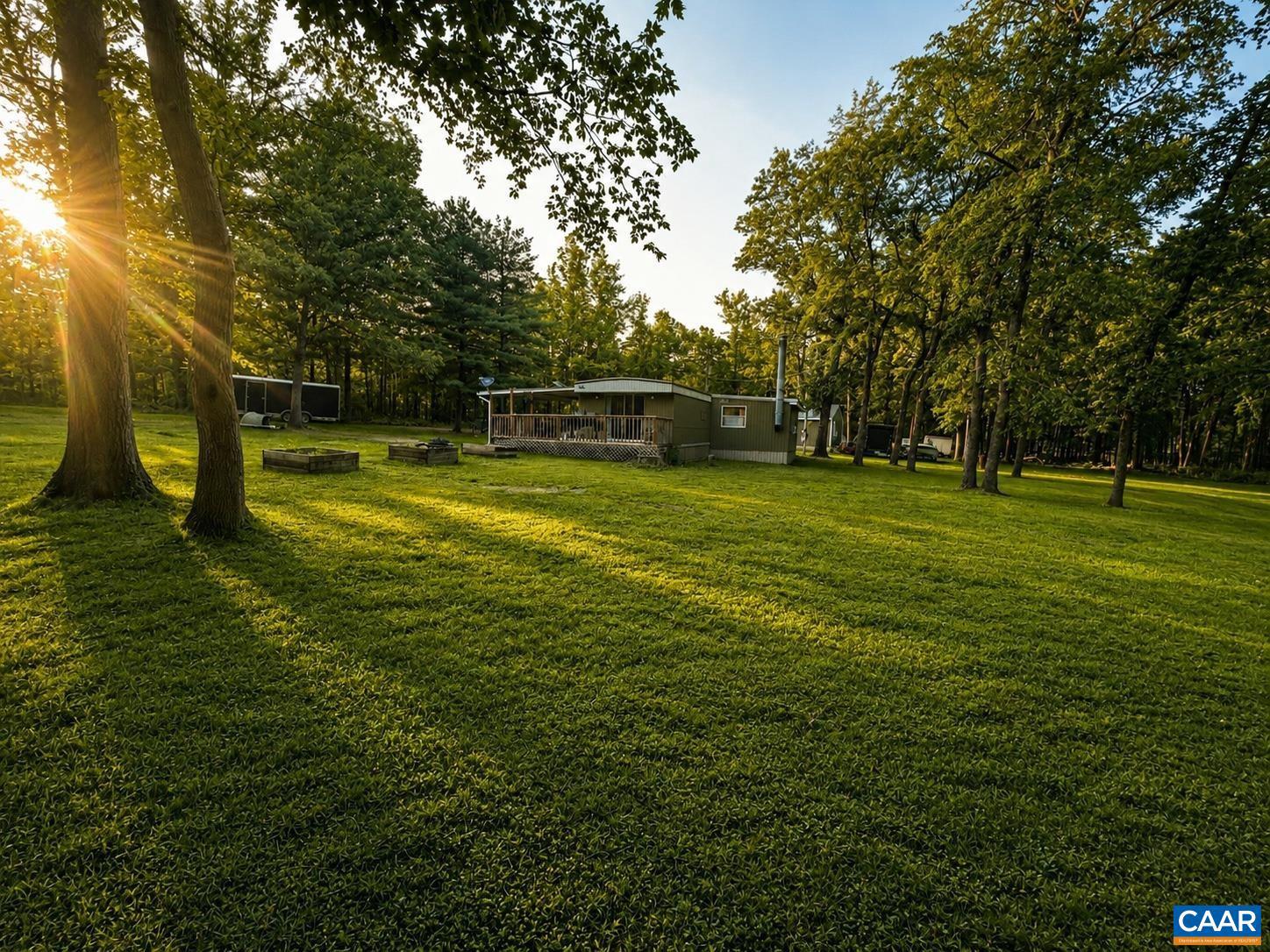 Escape to your own private retreat! Nestled on approximately 1.2 acres spanning three lots, this updated 3BR/2BA home offers the perfect blend of peaceful country living and everyday convenience. Surrounded by mature trees in a park-like setting, you'll enjoy exceptional privacy just minutes from historical downtown Luray, Stanley, New Market, US-211, US-340 and I-81. Inside features 1,326 finished sq. ft., an updated kitchen, a beautifully remodeled second full bath, updated flooring, new windows, and numerous improvements throughout. Relax on the new front and side decks overlooking the nature and wildlife to enjoy on your expansive lots. The detached garage/workshop is oversized provides excellent space for hobbies or storage. Recently re-coated roof. Exceptionally productive spring-fed well. Seller may also consider selling an additional adjoining �0.56-acre parcel separately with acceptable offer.,Granite Counter,Fireplace in Den