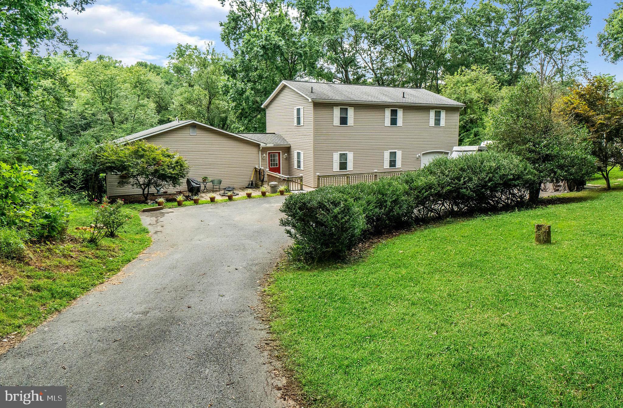 Quiet country home. Well maintained 4 possibly 5 bedroom home. Backs up to 40 acre farm (non-subdividable) and protected wetland (winters run). This Spacious home includes: 3 bathrooms, 4T 16 sear split system/propane heat/electric backup, handicap / wheelchair accessible, new hot water heater and pressure tank, well pump 3 years old (good water pressure), drainfields updated 5 years ago, quiet dead end lot- private, 3/4+ acre lot, ample parking, garage with freezer work shelves and tool racks, ceiling fans, new SS appliances + 2nd counter stovetop, great closet space, attic storage, nature abounds, backs to huge forest track and a sauna (used as dry pantry). Don t miss out on this one.