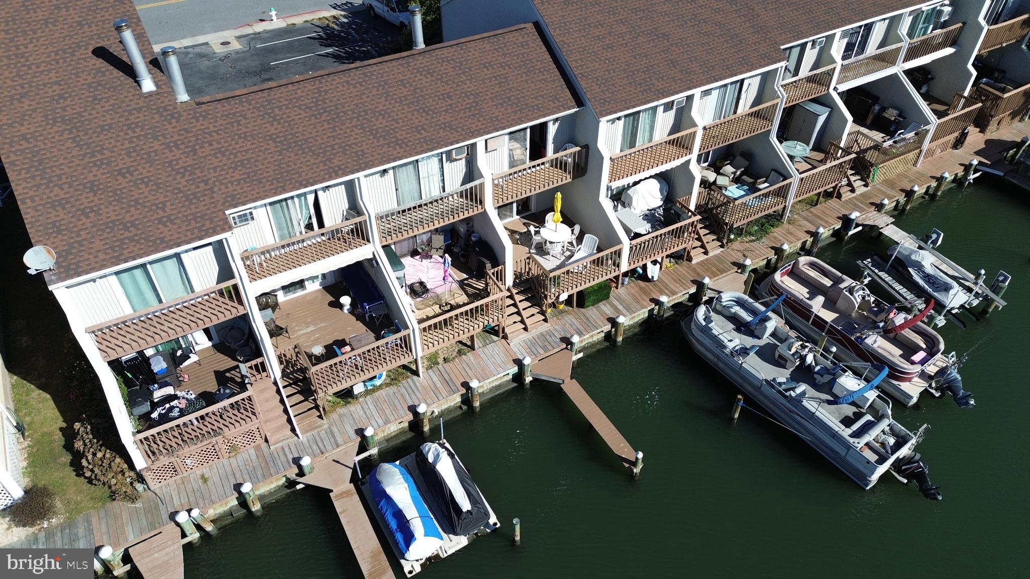 Welcome to your perfect retreat! This meticulously maintained 1-bedroom condo, featuring a spacious loft area and 1.5 baths, is ideally situated on 28th Street, offering stunning direct waterfront views. Built in 1982, this home combines classic charm with modern comforts. Imagine stepping out onto your fabulous rear sundeck, where you can soak up the sun and enjoy the tranquility of the deep, wide canal. The second-level patio provides an elevated view, perfect for morning coffee or evening relaxation.
With two brand new wall A/C units and affordable baseboard heat, you’ll stay comfortable year-round. Plus, the convenience of a deeded boat slip right in your backyard means you can park your boat at home and skip the hassle of winter storage! Whether you're looking for a weekend getaway or a permanent residence, this condo has everything you need. Don’t miss out on this incredible opportunity—this gem won’t last long! Schedule your showing today!