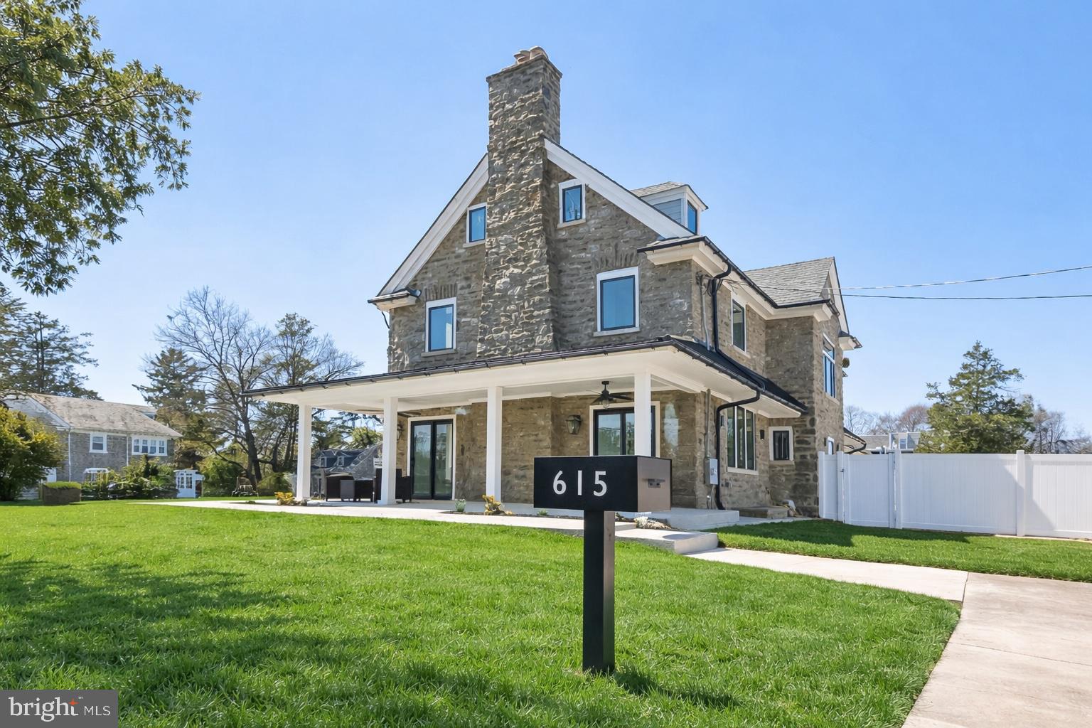 Welcome to 615 E. Mt. Pleasant Avenue — A Masterfully Reimagined Stone Residence.

This extraordinary home has been completely rebuilt from the inside out, seamlessly blending timeless stone architecture with sophisticated modern design and exceptional custom craftsmanship. Offering 6 bedrooms and 6.5 bathrooms, the residence delivers expansive, thoughtfully designed living spaces tailored for both elegant entertaining and comfortable everyday living.

A gracious wraparound porch welcomes you to the home, setting the tone for the architectural charm found throughout. Multiple French doors and oversized sliding glass doors invite natural light while creating a seamless transition between indoor and outdoor living spaces.

Upon entering, you are greeted by a dramatic grand staircase with elegant curved lines, establishing a striking focal point for the home. Wide-plank engineered hardwood floors and refined contemporary finishes flow throughout, creating a cohesive sense of warmth and modern sophistication.

The main level features three wood-burning fireplaces that anchor multiple living areas, providing inviting spaces for gathering, relaxing, and entertaining.  At the heart of the home is a fully custom chef’s kitchen, thoughtfully designed with premium custom cabinetry, sleek quartz countertops, and professional-grade Viking appliances. The adjoining dining area creates a natural and elegant setting for hosting family dinners or larger gatherings.

The home’s flexible layout includes several versatile living areas, including a spacious family room with radiant heated floors. A dedicated private office provides an ideal space for working from home or quiet study. The family room can also be utilized as a private guest suite or in-law accommodation. A well-appointed custom mudroom offers practical everyday storage with built-in cabinetry and organization.

The second floor features three generously sized bedrooms and three full bathrooms, including two private ensuite bedrooms. The upper level offers two additional bedrooms and a full bathroom, providing an ideal layout for family members, guests, or home office space.

The primary suite serves as a luxurious private retreat, featuring a spa-inspired bathroom with a freestanding soaking tub, oversized glass-enclosed shower, elegant marble finishes, and a large custom walk-in closet with built-in shelving and storage systems.

Comfort and efficiency have been carefully integrated throughout the home, including three-zone air conditioning and radiant heated flooring in the fully finished basement, which spans the entire footprint of the home and offers expansive space for recreation, entertainment, fitness, or additional living areas.

The property also includes a detached temperature-controlled stone garage, presenting exceptional potential for a future accessory dwelling unit (ADU), guest house, private studio, or office.

Perfectly positioned just blocks from the shopping and dining along Germantown Avenue and Cheltenham Avenue, and less than 10 minutes from the scenic trails of Wissahickon Valley Park and the historic Chestnut Hill business district, the home offers the ideal balance of urban convenience and natural beauty.

With its historic character, state-of-the-art systems, and complete luxury renovation, 615 E. Mt. Pleasant Avenue presents a rare opportunity to own a beautifully reimagined residence in one of Philadelphia’s most desirable neighborhoods.

Schedule your private showing today and experience this remarkable home in person.