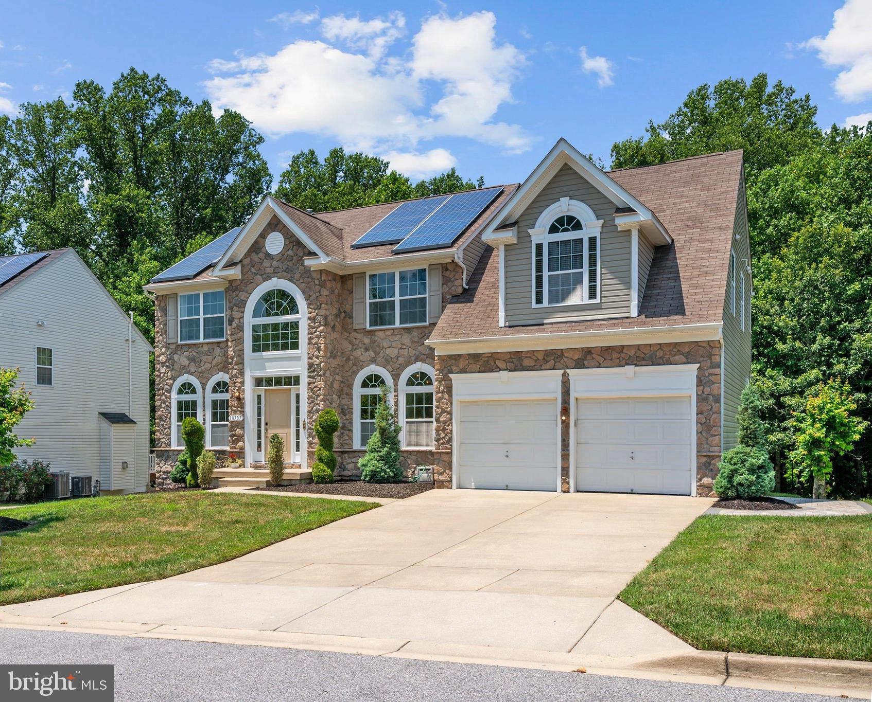 Welcome to tranquility. From the moment you enter the community, there is a sense of anticipation, and this stately home does not disappoint. Perfectly positioned on a slightly elevated lot, the home offers impressive curb appeal with mature trees, beautifully landscaped hedges, and a commanding presence.

Step inside and you are greeted by a grand two-story foyer, flanked by a formal dining room on one side and a formal living room on the other. The center hall staircase creates an elegant focal point and leads the eye into the dramatic two-story family room, where oversized windows fill the space with natural light. A gas fireplace adds warmth and comfort, making this the perfect gathering place for family and friends.

The family room flows seamlessly into the open-concept kitchen and upgraded rear bump-out, creating an ideal layout for entertaining, everyday living, and staying connected while cooking. The expanded eating and sitting area offers additional space to relax, dine, or gather, while double doors provide the potential for a future deck with elevated access to the backyard. The existing rear patio is ready for cookouts, outdoor dining, and enjoying the peaceful setting.

The main level also offers exceptional convenience with a laundry room and mudroom located between the kitchen and the two-car garage, as well as a private office/den that could also serve as a bedroom, plus a half bath.

Upstairs, the two-story foyer and family room create an open catwalk-style landing, adding to the home’s spacious and elegant feel. The second level features three generously sized bedrooms and a shared hall bath. At the end of the hall, the private primary suite offers a true retreat with double walk-in closets, a sitting area, and ample space for large furniture. The en-suite bath includes dual sinks, a private water closet, a soaking tub, and a separate walk-in shower with room to relax and unwind.

The finished basement is designed for both function and entertainment. This impressive level includes a dedicated gym space, a legal bedroom, the home’s third full bathroom, large rec room, and a theater room behind double doors. An additional finished room with sliding glass door access to the backyard offers endless possibilities, whether used as a game room, hobby space, or indoor-outdoor entertaining area.

The oversized backyard is just as impressive, offering plenty of space for barbecues, playtime, gardening, or creating multiple outdoor living areas. Backing to a tree preserve, the property offers privacy, peaceful views, and no rear neighbors, creating a true backyard retreat.

Additional highlights include solar panels provided by SolarCity to help reduce the home’s electric footprint, new carpet on the stairs and upper level, and a new sidewalk along the side of the home.

This home offers space, elegance, privacy, and everyday comfort in a truly serene setting. Do not miss the opportunity to make it yours.