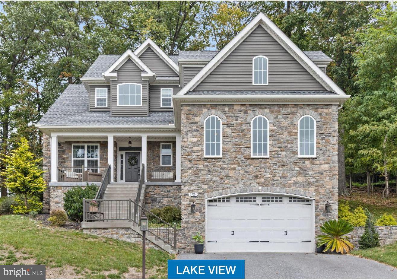 Seasonal lake view! Gorgeous custom home only 6 years old! Main floor primary suite! This home has everything you could ever want. The main level boasts a custom gourmet kitchen perfect for any chef, a separate dining room, living room off the kitchen with beautiful stone gas fireplace , an enormous family room/office/game room, a main level bedroom with private full bath, half bath, laundry, covered back patio and covered front porch. Upstairs there are 5 bedrooms (one currently used as a large office), and 3 full bathrooms. The lower level is fully finished with a huge family room and another full bath. The front of this home overlooks the lake and is a short walk to the trails and the water. Enjoy full access to all that Lake Linganore has to offer:- deep Navigable lake, multiple sandy beaches, multiple pools, boating, fishing, swimming, tennis, basketball, beach volleyball, nature & bike trails, Frisbee golf, pickle ball, Event Tent, Farmers Markets, Summer Concert Series under the stars, playgrounds and so much more! Come and see for yourself.