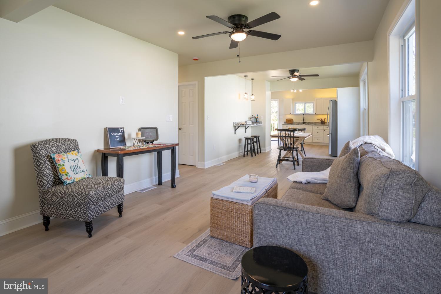 404 S. Marlyn Avenue | Essex, MD 21221 

Open House — Saturday, June 7, 11AM to 1PM. Come see it in person — you'll understand the moment you walk in!

Welcome home to this beautifully renovated gem in Essex, MD — where modern finishes, comfortable living, and an unbeatable price make homeownership not just a dream, but a reality!

Completely gut-renovated from the studs out, this move-in-ready Essex home delivers the kind of thoughtful, high-quality renovation that's hard to find at this price point. Every detail has been checked off — and then some.

First-Time Buyers — This One's For You
Why rent when you can own for about the same monthly cost? Down payment assistance programs are available, and you may be able to purchase this home with little to no money out of pocket. Reach out today to find out how!

The Main Level — Open, Bright & Made for Living
Step inside and be immediately welcomed by soaring 8-foot ceilings and an open-concept layout with a beautiful front-to-back view through the living room, dining room, and kitchen. Brand-new LVP flooring, LED recessed lighting, trendy light fixtures, and a tranquil zen-like neutral color palette come together to create a space that just feels like home the moment you walk in. Tall windows drench the main level in natural light, and the living room offers ample space for a generous wall-mounted TV — perfect for movie nights in!

The Coffee Bar — Yes, Really
If you're a coffee lover, you are going to lose your mind over this! Your very own private coffee bar features a granite wall-mounted counter, designer lighting, and a built-in electronics charging station. Sip your morning coffee here in your own little sanctuary — or take it outside to your brand-new 10x20 back deck, perfect for entertaining, relaxing, or soaking up those warm Maryland evenings!

The Kitchen
A true showstopper — white soft-close wood cabinetry, granite countertops, new stainless steel refrigerator, gas stove, and under-cabinet lighting you simply have to see in person. This kitchen was designed to impress!

The Bedrooms & Baths
Two generously sized bedrooms on the main level — including a front bedroom with a charming window seat, perfect for reading or people watching, plus two closets! The main level full bath features a tub/shower combo with ceramic tile surround, trendy finishes, and ample shelving, with a new stackable washer/dryer tucked neatly away. Upstairs, the third bedroom offers its own private en-suite with a walk-in shower and stylish ceramic tile surround — ideal as a primary retreat or guest suite.

The Peace of Mind
The big-ticket items are done — new architectural shingle roof and gutters, new siding, new AC system, updated plumbing and electric, new wood front porch, new back deck, and new washer and dryer. Just unpack and live!

The Location & Lifestyle
Essex, MD is a waterfront community lifestyle at its finest — boating, fishing, crabbing, and swimming are practically in your backyard! Add in convenient access to shopping, dining, major commuter routes MD-702 and I-695, and you have everything you need right at your fingertips.

Bonus — the home is zoned Residential Office (RO), meaning you could also run a business from this space. Confirm details with Baltimore County.
