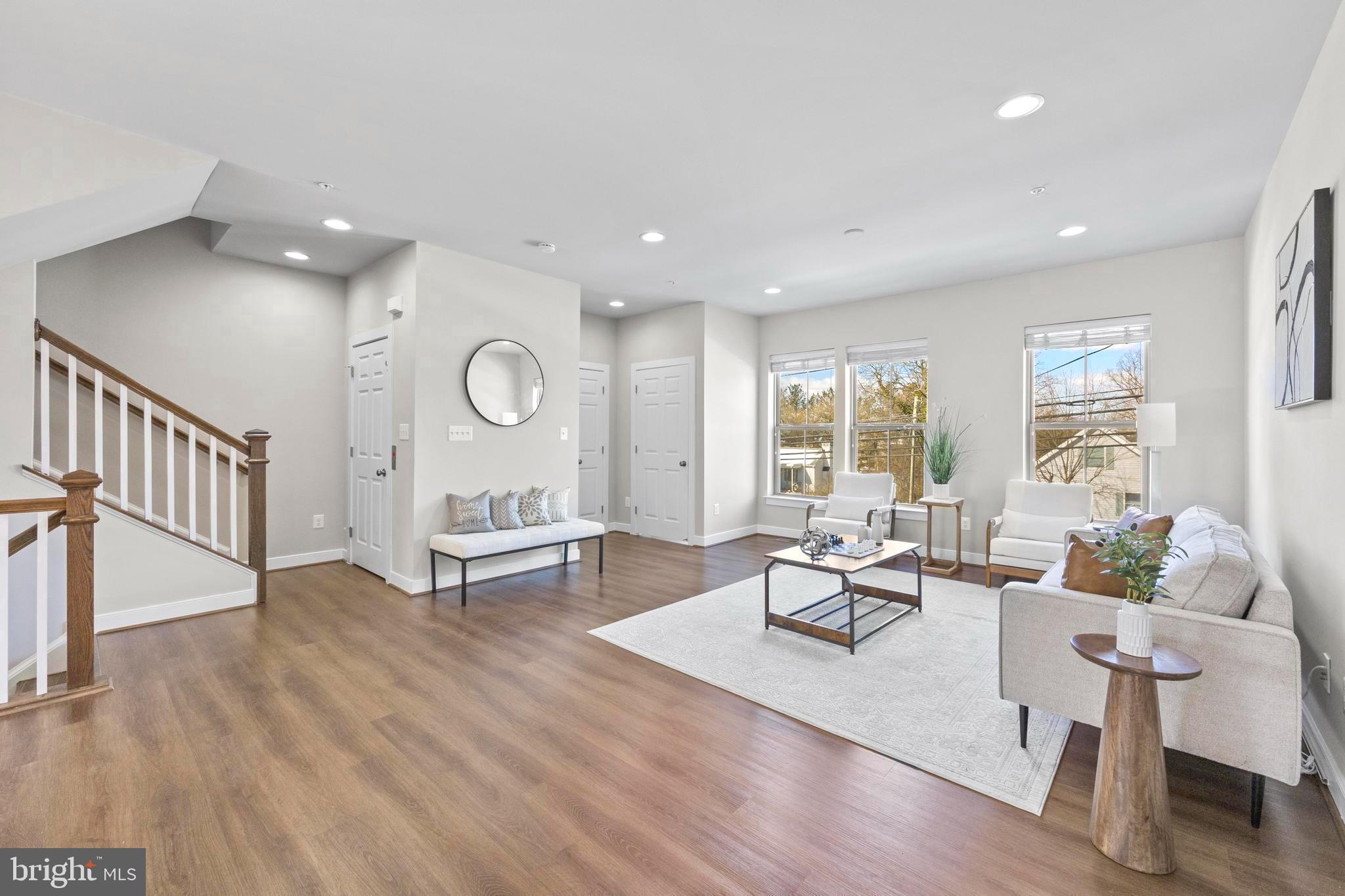 $40K PRICE IMPROVEMENT // RARE ELEVATOR HOME + ROOFDECK // UNDER $950K IN WOOTTON SCHOOL DISTRICT // CAN COVER CLOSING COSTS!!  A Stunning luxury townhome in the highly sought-after Travilah community; this is the only elevator townhome available under $950K currently in Rockville. Original owner and meticulously maintained, this former model home showcases premium builder upgrades throughout, including upgraded cabinetry, countertops, and enhanced trim details. Offering over 2,500 sq. ft. of modern open-concept living, the home features 4 bedrooms, 3 full baths, and 2 half baths. Modern wide-plank LVP flooring extends through the main level, complemented by oversized windows that fill the home with an abundance of natural light. The gourmet white kitchen is a standout, featuring stainless steel appliances, a large farmhouse sink, granite countertops, and crisp shaker cabinetry that flows seamlessly into the spacious living and dining areas, and opens to a private balcony. A private elevator offers seamless access to every level, adding both convenience and exclusivity. The rooftop terrace showcases views and features a versatile space that can serve as a pet area or be transformed into a putting green. Recent updates include refreshed paint throughout, modern LED and recessed lighting, updated bathroom fixtures and hardware, new mirrors, upgraded ceiling fans with remotes in every room, and a new energy-efficient front-loading washer and dryer, and newly installed LVP Flooring. Additional highlights include an attached two-car garage, two driveway spaces plus extra off-street parking, dual-zone HVAC for customized comfort, and ample storage throughout. This home is within the desirable Wootton High School district. Ideally located near shopping, dining, and major commuter routes. This home offers the perfect blend of luxury, convenience, and low-maintenance living. **Preferred Lender Credit toward Closing Costs, 2-Year Home Warranty Offered**