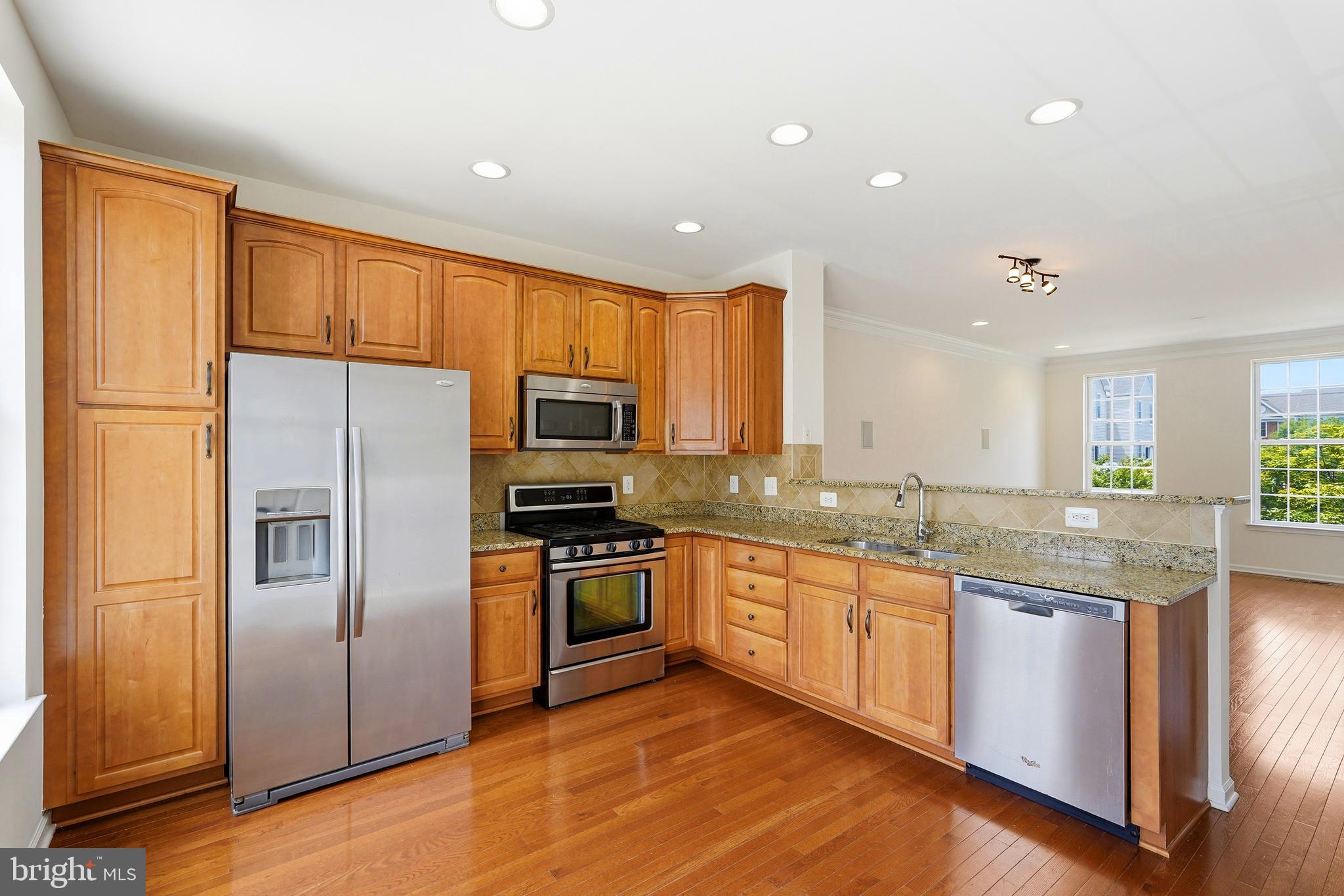 Tucked away for ultimate privacy, yet just moments from major routes, South Riding Market Square that houses significant shops, & county's state of the art Dulles South Recreation & Community Center, this cozy home gives all the warmth & secure atmosphere. Located in much sought after South Riding Sub-Division, a vibrant award-winning community in Dulles Technology Corridor.<br><br>Worry-free lifestyle where lawn care & exterior maintenance are handled through condo fees. Water & Sewer included too!<br><br>This freshly painted, move-in ready, sun-drenched, BRICK FRONT home built in 2012 by Toll Brothers offers 3 finished levels featuring 4 bed rms, 3 full baths, & a half bath. 9-FOOT ceilings, VAULTED ceilings at bed rms, & good sized windows keep the home airy &  well ventilated. A 2-CAR rear entry garage is completed w/painted walls & epoxy floors & is equipped w/built-in wooden shelves, garage opener, & a keypad entry. An additional parking pass for overnight parking!<br><br>Gleaming hardwood floors run thru the main level that seamlessly connect the living, dining, & kitchen in an open layout; ideal for both daily routines & hosting guests. Equipped w/four built-in, FLUSH-MOUNT WALL SPEAKERS & AUDIO VIDEO connections, the living rm transforms into a private cinema; perfect setup for unforgettable family nights right at home. Kitchen provides granite countertops, diagonally placed backsplash, stainless steel appliances, abundant cabinet space, & a balcony access for fresh air. A dedicated laundry closet w/shelving & FRONT LOAD LARGE-CAPACITY stainless steel Washer-Dryer on PEDESTALS & a powder rm complete the main level. Upstairs is the primary bed rm w/built-in CEILING SPEAKERS, walk-in closet w/window, & primary bath w/heat light. Two additional bed rms, hall bath, & linen finish this level. Downstairs presents a fourth  bed rm w/attached bath creating the perfect space for guests, a home office, fitness rm, or a play area. To add, recessed lights throughout!<br><br>Beyond the home, enjoy all that South Riding has to offer. Perfectly situated 30 miles west of Washington, D.C., & 10 miles east of Loudoun County’s beautiful horse country & vineyards. Breathe into this neighborhood!! Mature tree-lined streets w/access to exceptional resort-style community amenities: 4 outdoor swimming pools, 10 playgrounds, 4 tennis courts, a pickleball court, sports fields, miles of paved biking, walking trails, dog park, fishing & scenic ponds. A wide variety entertainment are hosted, including Tuesday night summer movies & Friday night concerts in the park. Indoor swimming pool, lazy river, fitness center, sports court & a rock-climbing wall, as well as an outdoor skate park & bike park at Dulles South Recreation and Community Center. Emergency services at Stone Springs Hospital just 3 miles west. Benefits of living within the community includes easy access to Dulles Airport, Loudoun County public schools; one of the top tier, shopping, dining, take outs, everyday needs, morning coffee, groceries, & local eateries are all right around the corner, as well as neighborhood businesses. This South Riding precious home offers an exceptional opportunity to enjoy a lifestyle of comfort, convenience, and connection.