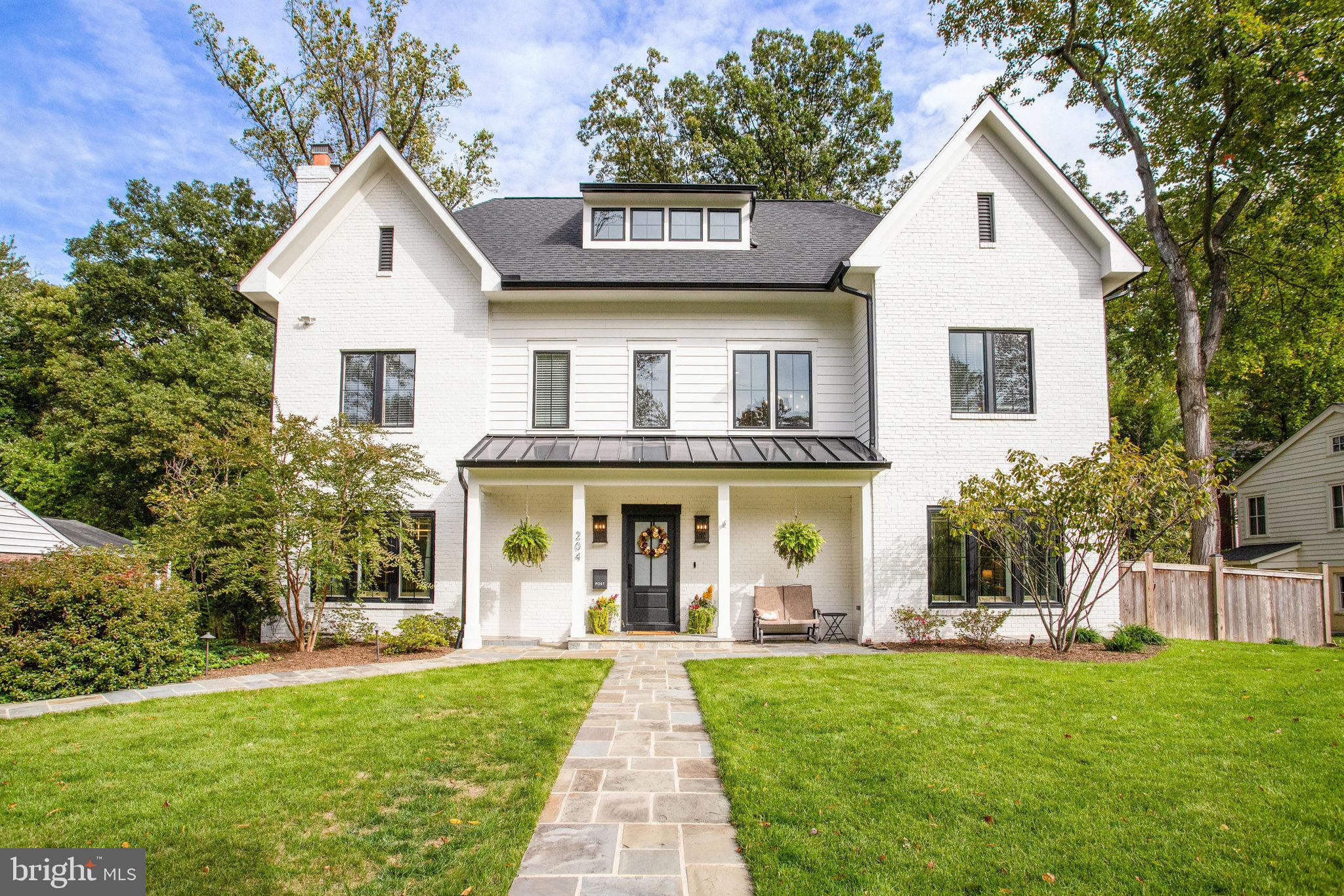 Beautiful 5BR/4.5BA Modern Home on 1/4 acre lot in quiet Broadmont neighborhood of 
Falls Church City.  Newly built in 2022 on existing foundation w/ over 5,000 sq ft of living 
space on three finished levels.  Hardwood Flooring and Luxurious products & finishes 
throughout including  Wolf appliances, Anderson 400 series casement windows, and 
5" red oak hardwood flooring.   Large screened back porch overlooking private backyard 
w/ Flagstone Patio, mature plantings & landscaping, plus Separate Garage. 

Main Level Grand entry Foyer enters to open floorplan with combination Dining room 
(w/ fireplace), Gourmet Kitchen with huge eat-in Island, 6-Burner Stove with Range Hood, 
plus wet-bar area.  Family Room w/ Gas Fireplace & Tray Ceiling, opening to screened porch, 
plus mud room.   Formal Living Room plus Den/office (can convert to bedroom) and powder room.

Upper Level Hall leads to Primary Bedroom Suite with Gas Fireplace & Tray ceiling, Dressing/
make-up areas plus His & Her walk-in closets.  Spacious Primary Bathroom with Dual Vanities, 
Separate Shower & Soaking Tub.  Second En Suite Bedroom w/ Full Bathroom, 
3rd & 4th Bedroom share a 3rd full Jack & Jill Bathroom, plus separate Laundry Room 

Lower Level features Large Recreation Room w/ Fireplace - Separate Den/Study/Office can 
easily convert to 5th bedroom.  Full Bathroom, Utility Room / Storage area, plus bonus 
Storage Room/Play room.

Amazing location near Four Mile Run Park, Benjamin Banniker Park & Benjamin Banniker Dog Park.  
Plus only 3/4 mile to East Falls Church Metro Station, with easy Access to I-66, I-495, 
Routes 7 & 50, and a short commute to Washington DC and The Pentagon.  
Fantastic Falls Church City School Pyramid w/ newly constructed Meridian High School.