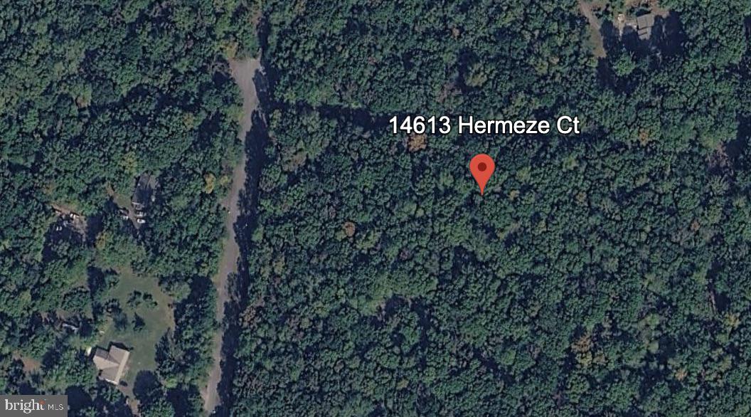 Discover the perfect canvas for your dream home on this stunning 5-acre lot in the serene Doe Run Estates. Nestled at the end of a peaceful cul-de-sac, this property offers a tranquil retreat with no thru traffic, ensuring privacy and quietude. Imagine waking up to the gentle sounds of a nearby stream and the rustling of trees, creating a harmonious connection with nature. The wooded surroundings provide a picturesque backdrop, ideal for outdoor enthusiasts and those seeking a serene lifestyle. With ample space to design your ideal residence, you can create a sanctuary that reflects your personal style and needs. This lot is not just a piece of land; it's an opportunity to build a home where memories will flourish. Embrace the beauty of nature while enjoying the convenience of nearby amenities. Your dream home awaits in this enchanting setting, where comfort and tranquility come together beautifully.