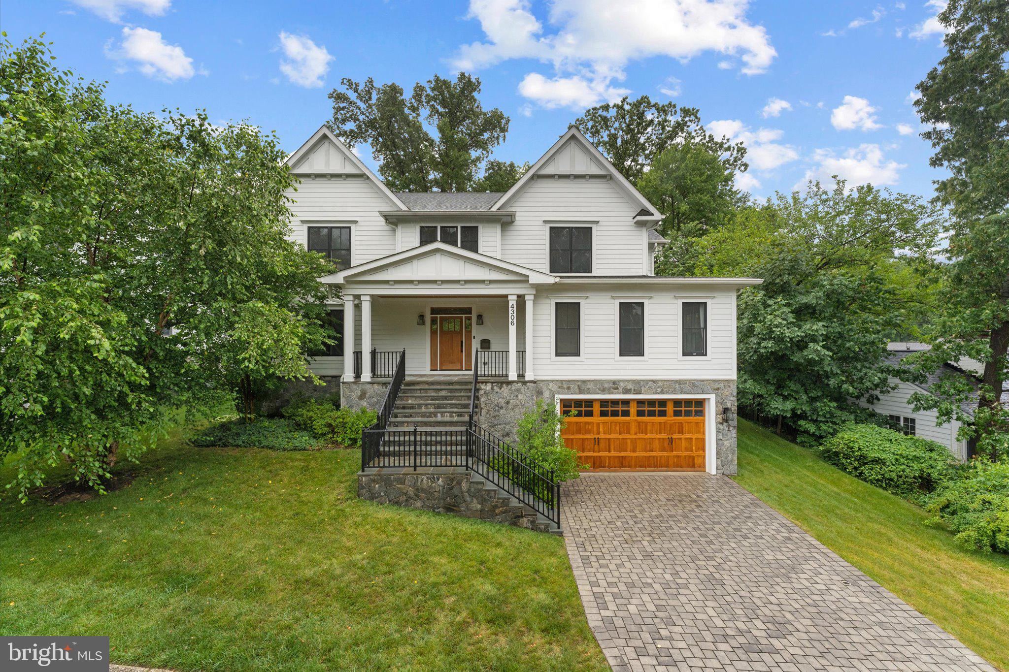 Appointment Only Open House July 26th 1-4 PM-Call your Realtor or Listing Agents --- Experience sophisticated modern living in this exceptional North Arlington residence, custom-built in 2020 by acclaimed M-R Custom Homes. Offering more than 6,600 finished square feet across three beautifully appointed levels, this impressive six-bedroom, six-and-a-half-bath home combines timeless architectural character, meticulous craftsmanship, advanced technology, and remarkable proximity to Washington, D.C., McLean, Georgetown, and Arlington’s most desirable destinations. --- An elegant exterior featuring Hardie Plank siding & Stone, Andersen 400 Series windows, architectural roof shingles, and a handsome paver driveway creates an unforgettable first impression. Flagstone-covered front and rear porches, along with a spacious rear paver patio, extend the living space outdoors and provide an inviting setting for relaxing or entertaining. The rear porch includes a ceiling fan, built-in audio, and a convenient gas connection for grilling. --- Inside, gleaming hardwood floors extend throughout the main and upper levels, complemented by hardwood stairs, nine-foot ceilings, recessed lighting, substantial crown molding, eight-inch baseboards, five-panel solid-core doors, and custom closet systems. The light-filled main level offers both elegance and versatility with a private home office and a comfortable guest suite with an attached full bathroom—ideal for overnight guests, extended family, or multigenerational living. ---- At the heart of the home, the dramatic family room showcases a coffered ceiling and a gas fireplace, creating a warm yet sophisticated gathering space. The adjoining designer kitchen is a culinary showpiece featuring custom inset maple cabinetry, quartz countertops, a Kohler Whitehaven apron-front sink, secondary preparation sink, tiled backsplash, under-cabinet lighting, water-filtration system, and an exceptional suite of Wolf, Sub-Zero, and Bosch appliances. A beautifully equipped butler’s pantry with a beverage refrigerator makes entertaining effortless. ---- The upper level presents four spacious bedroom suites, each with a private bathroom finished with custom tile and Kohler fixtures. The spectacular owner’s retreat feels like a private luxury hotel suite, complete with a tray ceiling, separate sitting room, two walk-in closets and an indulgent spa-inspired bathroom. Its highlights include dual vanities, a 67-inch Serafina soaking tub, an oversized shower with seamless glass enclosure, private water closet, and refined designer finishes. A conveniently located upper-level laundry room further enhances everyday living. ---- The expansive finished lower level is designed for recreation, wellness, guests, and storage. It includes an oversized recreation room, private gym, sixth bedroom with an attached full bathroom, mudroom, and generous finished storage. A designated location for a future elevator provides an opportunity for convenient access to all three levels. ---- This thoughtfully designed smart home is equipped with built-in Sonos audio throughout multiple interior and outdoor spaces, Eero Wi-Fi, CAT 6 wiring, ADT security infrastructure, a Ring doorbell, exterior cameras, motion-activated lighting, and robust 400-amp electrical service. Additional premium features include Restoration Hardware window treatments, Hunter Douglas shutters, a two-zone Carrier HVAC system, Aprilaire humidifier and air cleaner, Wi-Fi thermostats, and a 75-gallon water heater. ---- Located within the sought-after Yorktown High School pyramid, this extraordinary home offers exceptional access to everything that makes North Arlington living so desirable. Fort Ethan Allen Park is less than one mile away, while Chain Bridge and Washington Golf and Country Club are approximately 1.6 miles away. Downtown McLean is approximately 3.4 miles, Ballston Metro 3.9 miles, Georgetown 5.2 miles, and Reagan National Airport 8.9 miles away.