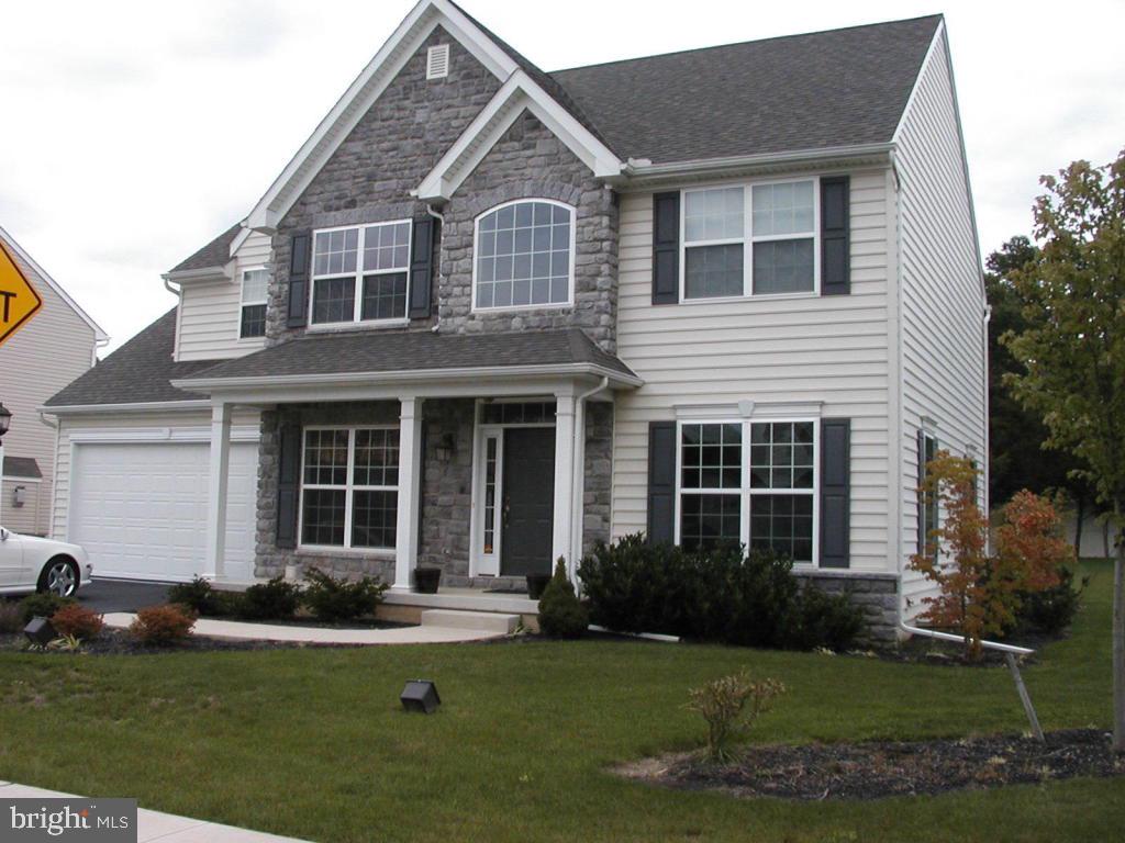 Former model home!  2800 square feet + 600 square feet of finished basement.  4 bedroom, 2.5 bath, LR, DR, & 1st floor office.  Eat-in kitchen with granite tops & stainless appliances.  Hardwood floors and FR which has vaulted ceilings & a fireplace.  Owner suite includes tile bath with Jacuzzi tub.  Home also has sound system & security system.  Gas heat.  W/D & fridge included.  Available mid-September.