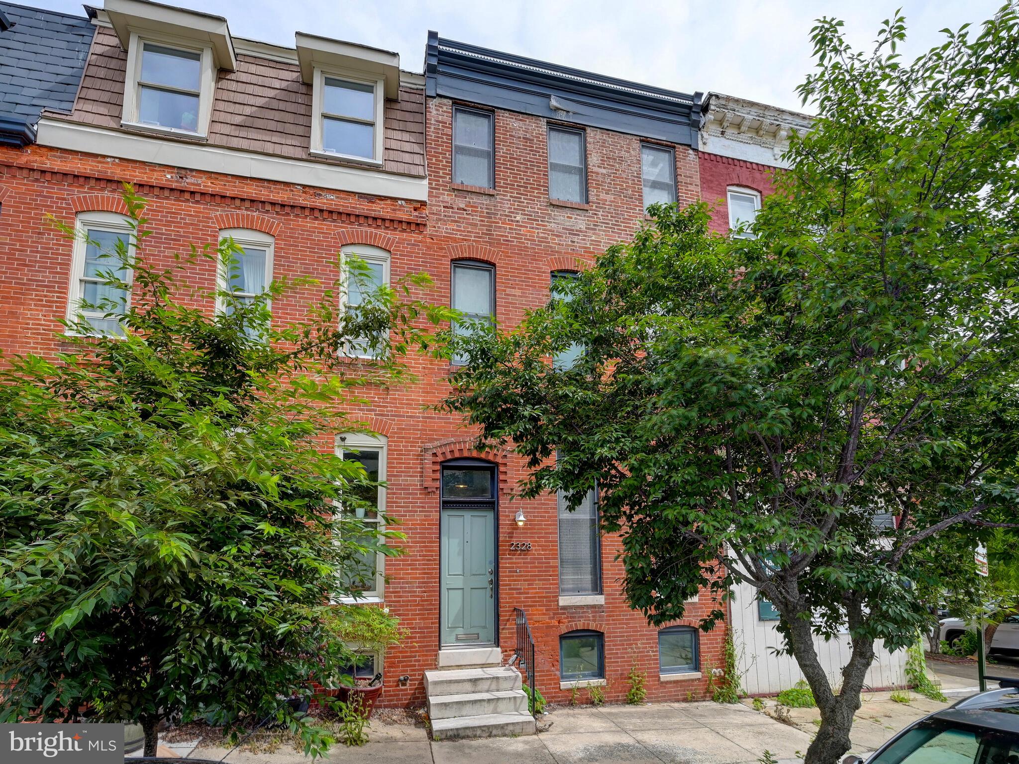 This home just one block from Patterson Park  was fully renovated in approximately 2005. It has great space, an open layout, a parking pad and a roof deck. Above grade, it is just under 2,500 square feet with 3 bedrooms, 2.5 full baths and a third rec room/bonus space with access to the roof deck. In addition, it has 600 finished square feet in the lower level with great ceiling height, brand new flooring and large closets, and an additional full bath, perfect for an added bedroom or guest space. Large unfinished storage space as well. The ceiling height is wonderful throughout the home and the home has some great features such as tin ceilings in the living room and primary suite, exposed brick and a gas fireplace. It has a large gourmet kitchen with a huge island and lots of cabinets and counter space, a large, custom walk-in closet in the primary suite and a stand alone soaking tub in the en suite primary bathroom.  Great closet space in each room. Super convenient second floor laundry. The roof deck has lovely park and city views. Out back there is an enclosed courtyard perfect for grilling and to let your pets out. Beyond that, there is an easy to access parking pad. This home is  one block from Patterson Park and is technically in "Patterson Place" which is one block east of Butchers Hill and just west of the Patterson Park neighborhood. Shuttle stop within a block and easy walk to JHH.