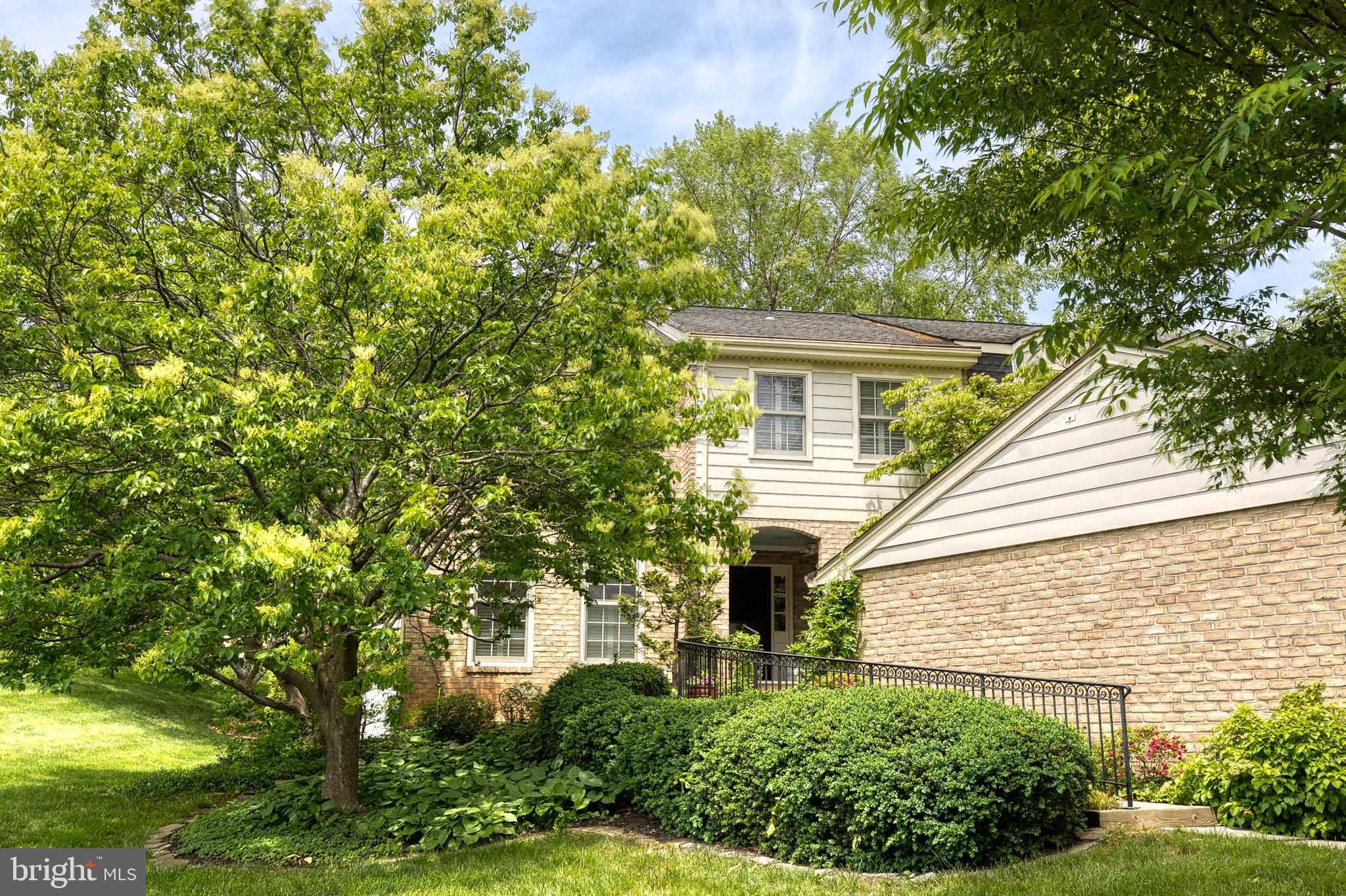 Exceptional Properties. Exceptional Clients. Welcome home to this picture perfect, move-in ready and rarely available end of group townhome featuring 3 bedrooms 3 and half baths with thoughtful details at every turn. Walk up the bluestone paved pathway alongside your spacious garage, lined with blooming flowers and a custom wrought iron railing and be greeted by a serene fish pond and private front porch. A true oasis welcomes you at your front door, this is the perfect spot to enjoy your morning coffee or a relaxing beverage.  Step inside to a charming and newly renovated home with sophisticated hand-painted floors in the foyer and gleaming hardwood floors throughout. Custom millwork and crown moulding add architectural detail to the home and plantation shutters offer privacy while still allowing the sunlight to stream in. The open-concept kitchen boasts brand-new stainless steel appliances, a butcher's block island, gas cooktop and a cozy sitting area that flows seamlessly to the spacious dining and living spaces. A beautiful hearth anchors the living room featuring a wood-burning fireplace (with gas connector) and large floor to ceiling windows with natural light pouring in. The dining room offers multiple seating options with a nearby bar top and stools and room for a large dining room table.

Open the large sliding glass doors off the dining room and step outside to the custom deck featuring elegant Chippendale railings with steps down to a brick herringbone patio—perfect for outdoor entertaining. With expansive gardens, mature trees and open greens pace, the yard is a unique property in the neighborhood.

Climb the stairs to the second level, with a custom chippendale railing and designer runner and be greeted by three generously sized bedrooms and two beautifully appointed baths. The luxurious primary suite offers a private sitting area with a custom wool rug and a walk in closet equipped with a convenient in-suite laundry. The two additional bedrooms have custom wall to wall carpeting, generous closets, and plantation shutters for privacy. 

The spacious lower level offers incredible flexibility with a handsome finished clubroom and entertainment area with custom built-ins, a large art studio, a second laundry area and thoughtful storage closets throughout. With a third full bathroom in the basement, there is plenty of space to create an additional bedroom if desired.

This meticulously cared for home features a brand new dual zone HVAC (2024), roof (2020), and propane tank (2024) and tankless hot water heater. The single-car garage has plenty of storage space equipped with built-in cabinetry and shelving. Enjoy the community pool, tennis and pickleball courts with an unusually low HOA ($280/month) in this centrally located Baltimore county with easy access to downtown. Don’t miss this rarely available end of group in Charlesbrooke!
