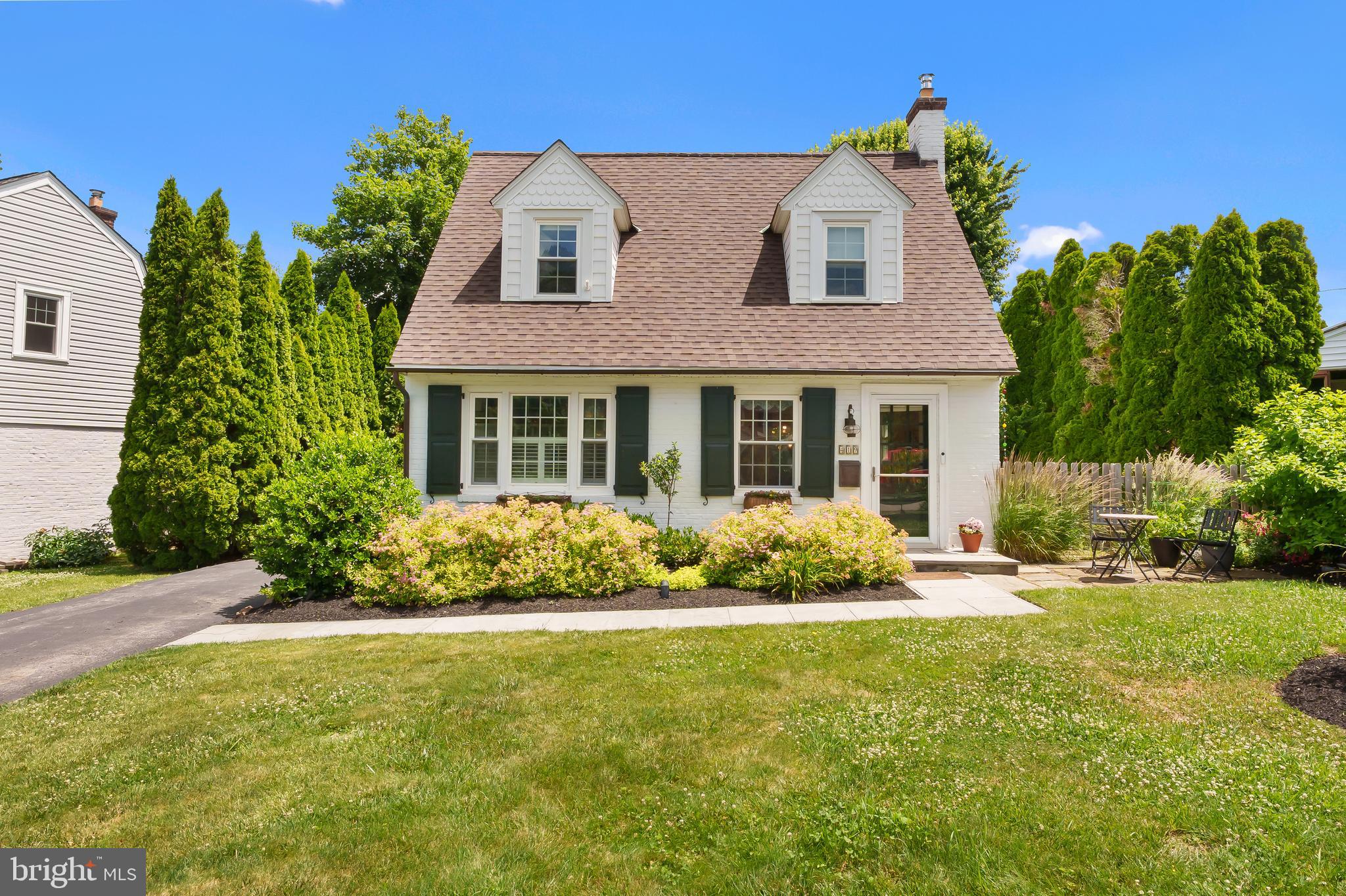 Nestled on a quiet cul-de-sac in the heart of Wayne, 419 Locust Road is the perfect blend of timeless charm, modern convenience, and an unbeatable Main Line location. Set on a beautifully landscaped lot just moments from Lancaster Avenue, this picture-perfect Cape Cod offers the warmth and character buyers are searching for in one of Radnor Township's most desirable neighborhoods.

A welcoming stone walkway leads to the front entrance, where hardwood floors, abundant natural light, and classic architectural details create an inviting atmosphere from the moment you step inside. The thoughtfully updated kitchen features quartz countertops, newer appliances, a tile backsplash, and ample workspace, flowing seamlessly into the dining area and family room—ideal for both everyday living and entertaining.

The main level also offers a full bathroom and a versatile home office, while upstairs you'll find a spacious primary bedroom with dual closets and a cozy reading nook, along with two additional bedrooms and a second full bath.

Outside, enjoy peaceful mornings and summer evenings on the rear patio overlooking mature landscaping and a private backyard retreat. A detached one-car garage and unfinished lower level provide additional storage and future potential.

Located within the award-winning Radnor Township School District and just minutes from downtown Wayne, Lancaster Avenue shopping and dining, the Radnor Trail, parks, and major commuter routes, this charming home offers the rare opportunity to enjoy a quiet neighborhood setting without sacrificing convenience. A true Main Line gem ready for its next chapter.