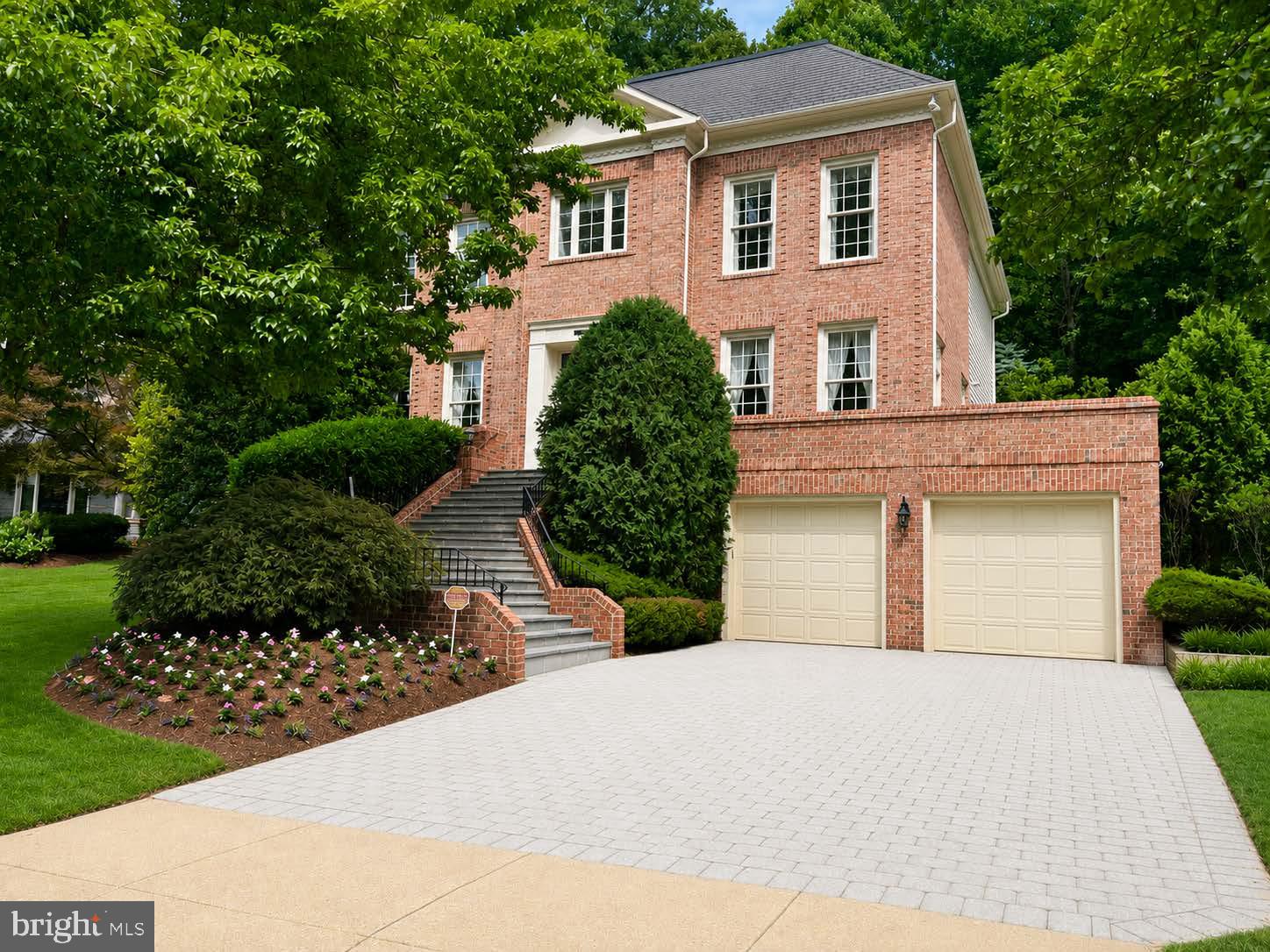 Welcome to 8011 Summer Mill Court, a stately brick Colonial tucked away on a premier lot in Frenchman’s Creek, a small enclave of homes within the highly desirable Burning Tree Valley subdivision. From the moment you enter the grand two-story foyer, flanked by dramatic architectural columns and a sweeping staircase, the meticulous craftsmanship and timeless design are on full display.  Designed for effortless living, the home features a rare 3-level elevator providing seamless access from the garage to all floors. The main level boasts 10 foot ceilings with a formal living room and dining room, a sprawling family room with a custom-built-in entertainment center, and a true chef’s kitchen. The kitchen serves as the warm heart of the home, beautifully appointed with rich, expansive granite counter tops that provide endless meal preparation space and a matching center island for casual gathering. Complemented by timeless solid wood cabinetry, the space is fully equipped for epicurean adventures. Directly adjacent, a sun-drenched breakfast room overlooking the private backyard.  Upstairs, the private quarters are headlined by an expansive primary oasis and a spa-like en suite bath with a deep soaking tub framed by beautiful window views. The primary suite has been uniquely enhanced by converting a bedroom into a second primary dressing room outfitted with premium built-ins and an abundant closet system. Two additional bedrooms share a classic Jack-and-Jill bath. While currently configured as a highly luxurious 4-bedroom home, the dressing room can easily be converted back to create a 5-bedroom layout.  The lower level offers exceptional flexibility with an expansive rec room, a dedicated exercise/bonus room, an additional bedroom perfect for an au pair or a long-term guest, a full bath, and a separate laundry room. This level includes convenient garage access and abundant storage.  Outdoor living and entertaining are a breeze with two distinct, beautifully designed spaces. Off the kitchen and family room, a sprawling flagstone patio looks out over the private backyard. For a more elevated experience, step onto the raised flagstone terrace located off the living room and beautifully framed by a classic brick surround. This perfectly situated property is surrounded by lush landscaping and mature trees, offering an exceptional level of privacy that is effortlessly maintained by an outdoor sprinkler system.  Complete with a multi-car garage, this masterpiece offers unparalleled space, flexibility, and prestige. Situated inside the Beltway, this home is just minutes to Downtown Bethesda with easy access to River Road, I-495, I-270, ensuring an effortless drive into downtown Washington, D.C.and Northern Virginia.  Welcome Home!