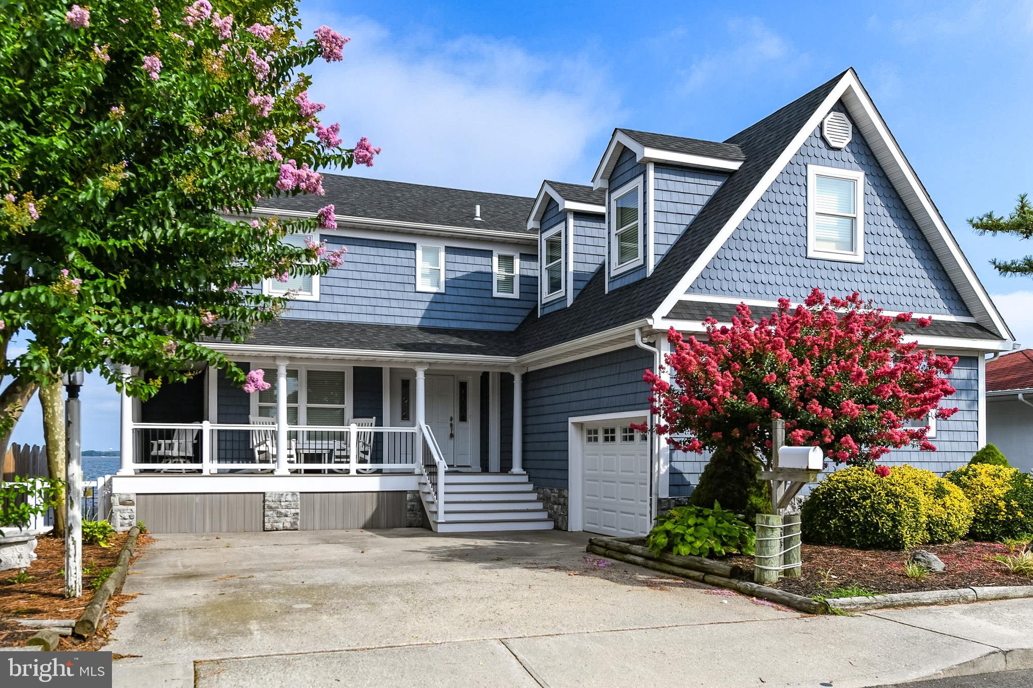 Ultimate Bayfront Dream Home. Major Upgrades through out  in 2018. 2 Boat Lifts. Gas Fireplace. Gas heating on first floor and Heat Pump on the second floor. Additional Bedroom  above Garage with Separate Bath.  Upgraded Vinyl Floors Throughout, except in bedrooms which has plush carpet. New Bulkheading installed in 2018.   Out side storage for your boating equipment. Watch the Fireworks Display at North Side Park from your private deck.
