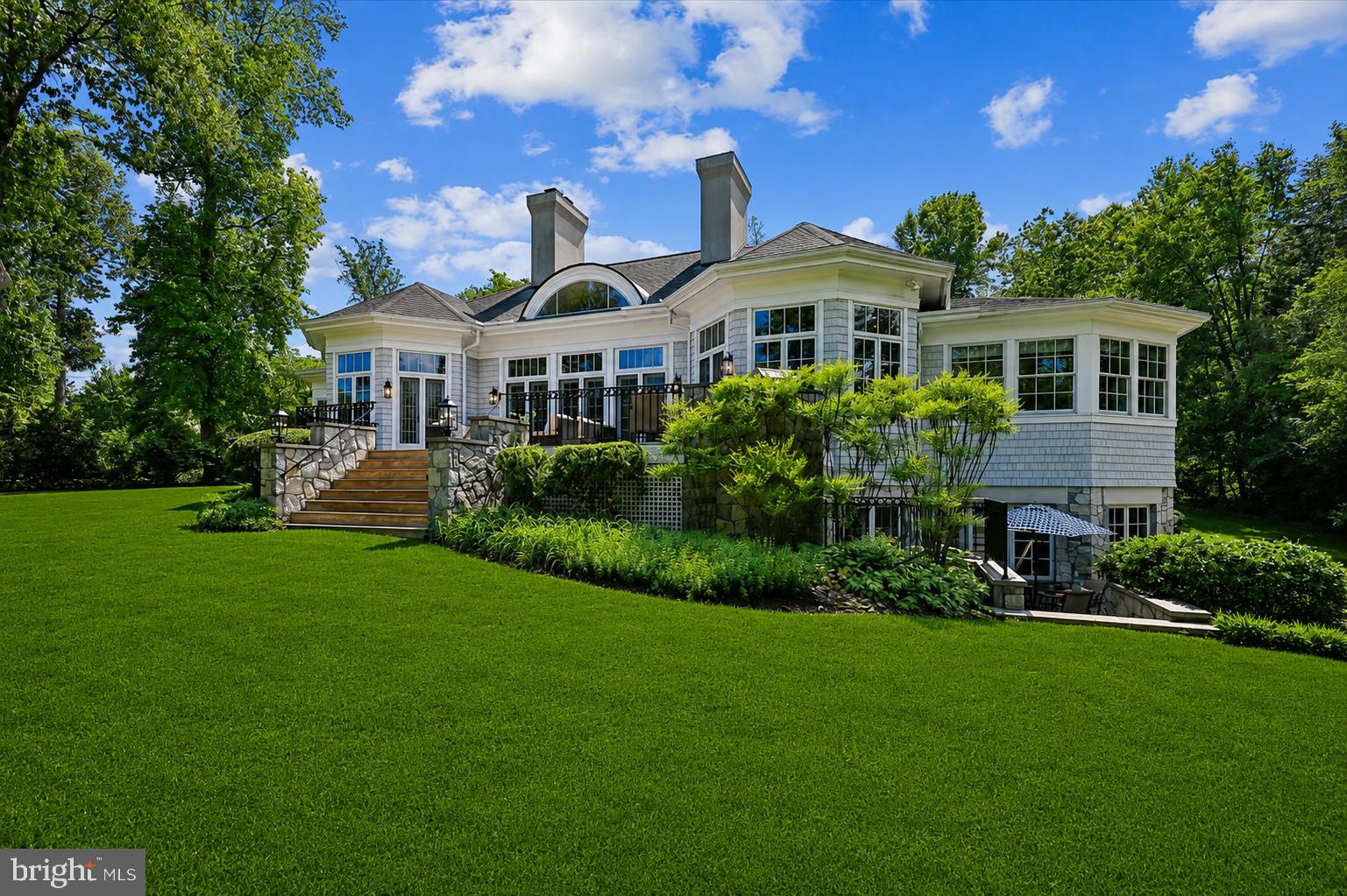 Nestled in the highly sought-after waterfront community of Poplar Point, this exceptional estate offers waterfront living at its finest on Church Creek just off the South River, complete with a private dock and boat lift for effortless days on the water. Tucked away at the top of a cul-de-sac and the end of a long driveway, the home offers a private and picturesque setting with exceptional indoor and outdoor living spaces designed to embrace the beauty of its surroundings.

Thoughtfully designed for both everyday living and entertaining, the expansive open main level showcases soaring ceilings, a stunning living room with fireplace and custom built-ins, and walls of French doors that frame breathtaking waterfront views while seamlessly connecting indoor and outdoor spaces. The open layout, circular layout including the formal dining room offers access to the expansive back deck, creating the perfect flow for entertaining. The chef’s kitchen is beautifully appointed with a large center island, abundant cabinet and counter space, and top-of-the-line appliances sure to impress even the most discerning cook.

The main level features four generously sized bedroom suites, each with its own private bath, providing exceptional comfort and privacy for family and guests alike. The luxurious primary suite serves as a true retreat, offering a spacious light-filled bedroom, spa-inspired ensuite bath, and an oversized walk-in closet with custom organization and water views. The second primary suite offers wrap around windows that frame the water view, built ins for organized storage, ensuite bathroom, and walk-in closet.

The fully finished walk-out lower level expands the home’s incredible living space and is ideal for entertaining, multigenerational living, or an au pair.  The private retreat features a bedroom with walk in closet, en suite bathroom, kitchenette, living room, and private patio. In addition to the private suite,  enjoy a spacious recreation room with fireplace, game area perfect for a pool table, half bathroom, and ample storage. 

Outside, the home is truly an entertainer’s delight. Multiple outdoor living spaces include an expansive deck off the main level overlooking the backyard and Church Creek. Whether enjoying quiet mornings by the creek, hosting summer gatherings, or heading out for a day on the South River from your private dock, every detail of this property has been designed to maximize the waterfront lifestyle.

Completing the home is an oversized 3-car garage with a dedicated work area and bench, offering ample storage and functionality. Set within one of the area’s most desirable waterfront neighborhoods, this rare offering combines timeless elegance, thoughtful design, premier boating access, and exceptional waterfront living in an unmatched South River location.

Only minutes to Downtown Annapolis, easy access to the highway for commuters, and around the corner from shopping and restaurants, this one is not to be missed!
