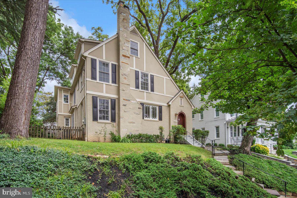 Nestled on a quiet, tree-lined street in the heart of Chevy Chase West, this stately and expanded 1929 Tudor offers a rare blend of classic architecture, high-end modern updates, and an exceptional location. Boasting over an estimated 3,900 sq ft of finished living space, this spacious home features five bedrooms, five full and one half bathrooms across four levels, each of which has been tastefully updated with premium materials and thoughtful design.

Inside, timeless charm meets modern convenience with stunning hardwood floors, elegant moldings, and wood-burning fireplace. The renovated kitchen is a chef’s dream—featuring sleek cabinetry, new Quartz countertops, stainless steel appliances (Thermador and KitchenAid) which opens to a large family room, overlooking the private backyard. Additional features of the main level include a welcoming foyer with charming arched door and coat closet, large living room with ample natural light slipping in the multiple updated windows. A spacious dining room is situated between the formal living room and the large family room and kitchen. Enviable flow provides a wonderful setting for both formal dining and informal entertaining.

Upstairs, the spacious and serene primary suite offers a true retreat, complete with a walk-in closet space and an updated en-suite bath featuring a double vanity, separate bathtub, water closet and a glass enclosed shower. On this level are two additional bedrooms and two full bathrooms. The top floor provides a great retreat for guests or even a teen suite - with flexible living space featuring two more bedrooms and a large full bath. The finished lower level includes a recreation room, fifth full bath, and separate laundry room.
A private rear retreat with paver patio, situated off of the family room, offers room to relax or entertain, while mature plantings and grassy yard offer a shaded space to play. Lastly, a detached garage completes this offering.

Ideally located just steps from Norwood Park, and within walking distance to downtown Bethesda, Friendship Heights, Bethesda Metro, and top-rated Montgomery County schools, this home provides the perfect balance of suburban tranquility and urban access.


Floorplan reflects square footage of 3,930 (finished) and 4,290 (finished and unfinished).
Public record reflects total square footage of 3,796. 
All measurements are approximate. Property details and square footage should be independently verified, and not used for property valuation.