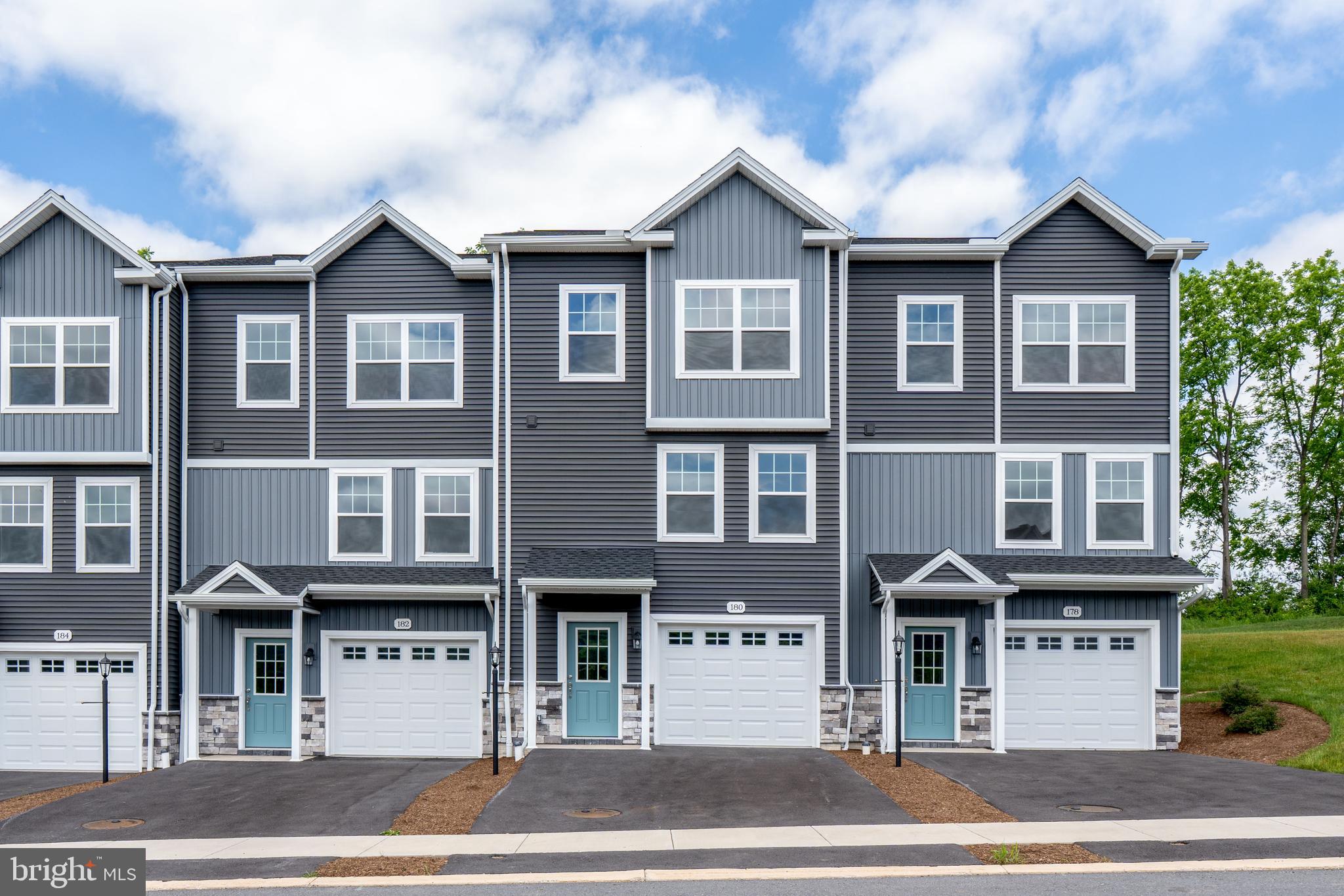 Steeplechase offers a suburban setting with walking paths and landscaped common areas, located 5 minutes from I-99, near Historic Bellefonte, and 10–15 minutes from Penn State University. 

The Redfield townhome plan features a kitchen with quartz countertops,  upgraded cabinetry, a center island with overhang, and Whirlpool appliances, including a smooth top range, microwave, and dishwasher. Wafer LED lighting is included throughout. A 10' x 10' pressure-treated deck provides outdoor space. The owner’s suite includes a private bath, and second-floor laundry adds convenience. The home also includes an unfinished basement, a garage door opener, and central air.

Contact us for more details on this home.
