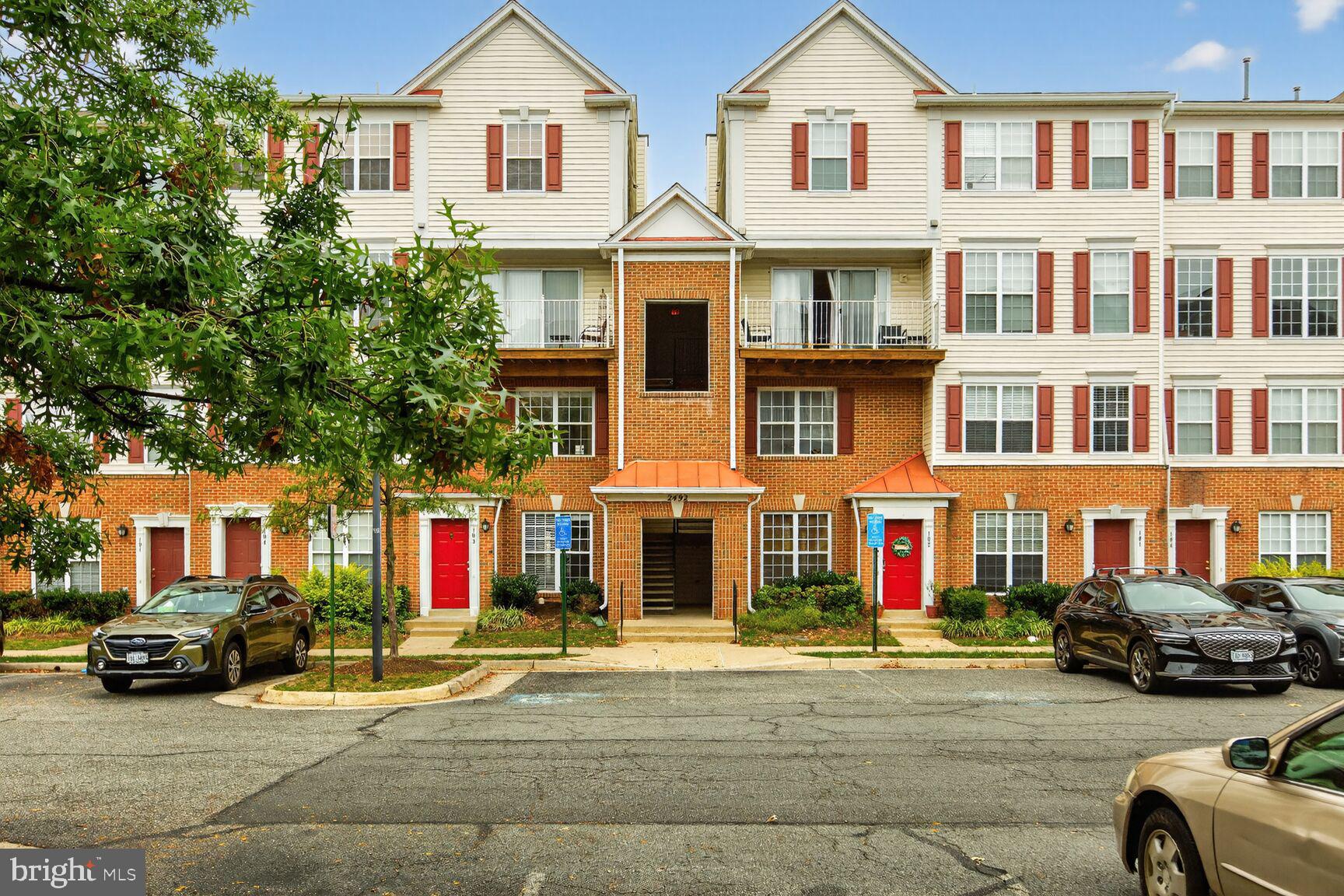Stately elegance defines this beautifully renovated and NORTH EAST FACING, like-new two-level luxury condo in the highly desirable Manors at McNair Farms community. This spacious residence—the largest model in the neighborhood—features 2 bedrooms, 2 full bathrooms, and 1 half bathroom, offering a layout that lives like a townhome with a private rear patio on the lower level. The home has been completely upgraded throughout, beginning with freshly painted interiors including walls, doors, trim, and ceilings. Brand-new, upgraded NuCore waterproof wide-plank luxury vinyl plank flooring spans both levels, complemented by wood stairs for a cohesive, modern look. The fully renovated kitchen showcases expanded countertops with upgraded white quartz, a new sink and faucet, stylish backsplash, upgraded stainless steel appliances, and freshly resurfaced and painted cabinetry. The lower-level powder room has been thoughtfully updated with a new vanity, faucet, mirror, and light fixture. Upstairs, two generously sized primary suites feature recessed lighting, new light fixtures, and walk-in closets, with both bathrooms fully upgraded to include new vanities, mirrors, faucets, showerheads, and toilets, along with freshly resurfaced tubs and showers that present like new. Additional enhancements include new vents, upgraded lighting throughout, brand-new window blinds, and a completely new HVAC system. The abundance of recessed lighting and large windows fills the home with natural light, eliminating the need for additional fixtures. Ideally located just minutes from the Silver Line Metro, major highways, Dulles Airport, and Reston, this community also offers ample parking and a very low condo fee, making it an exceptional value in a prime location.