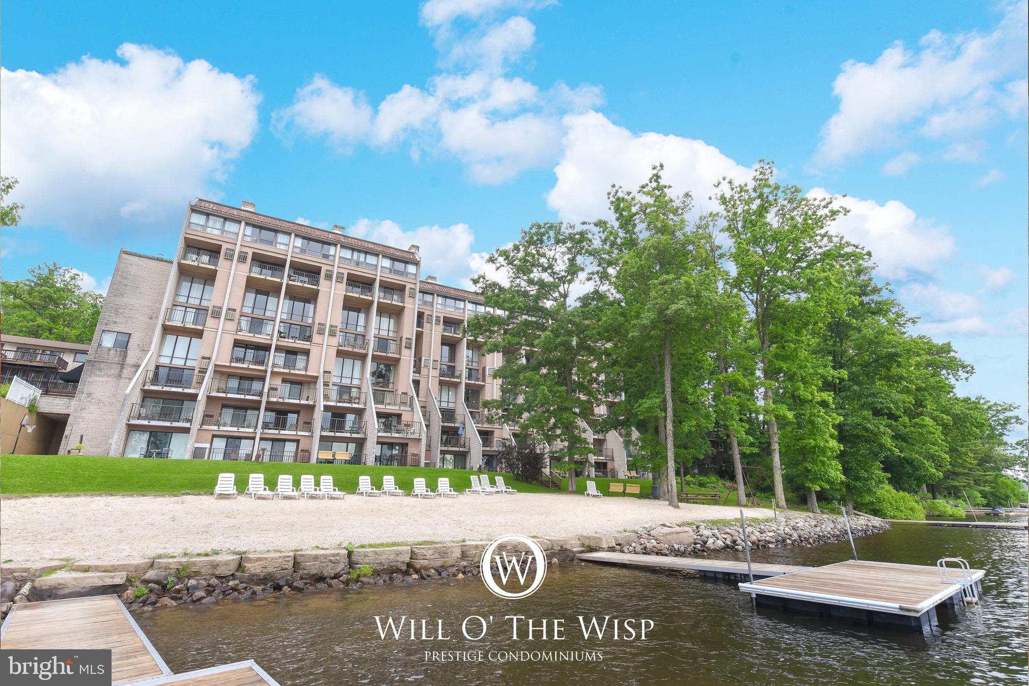 Experience lakefront living with this charming two-level condo at Will O the Wisp at Deep Creek Lake! Offering 2 bedrooms and 1 full bathroom, it captures breathtaking lake views from both levels. The main floor features a functional kitchen and a cozy living area with a wood-burning fireplace—perfect for relaxing after a day on the water. Upstairs, you’ll find two comfortable bedrooms and a full bathroom. Community amenities include an indoor swimming pool, fitness center, sandy lakefront beach, and the option for boat slip access through the association. Plus, you’re just steps away from local favorites like Ace’s Run and Firewater Kitchen & Bar. Whether you’re seeking a weekend retreat or a year-round getaway, this condo offers the perfect opportunity to make your own mark at Deep Creek Lake.