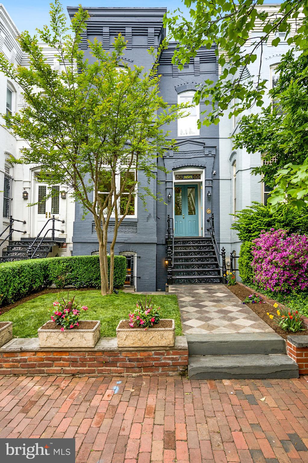 Enjoy the old-world charm of Georgetown with the amenities of a new build. Located in the heart of Georgetown, this home showcases 4,140sq/ft of beautiful interior living space. This 1870’s classic Victorian townhouse was completely renovated in 2015 and transformed for modern living with additions including new LED lighting throughout, top-of-the-line appliances, and new systems in place to achieve maximum energy efficiency, + so much more. Featuring antique heart pine floors and soaring ceilings throughout, soaked in natural light from new skylights and large windows throughout. Main Level opens through vestibule to light-filled Living Room with fireplace and Dining Area with wainscoting; Level flows into a modern living open floor plan between eat-in Kitchen with large center island, banquette seating, marble countertops, and Family Room with coffered 12 ft ceilings and fireplace. Grand-scale French doors lead seamlessly from Family Room to rear Patio/Garden. Sun-soaked Second Level features updated Primary Suite with Cathedral ceiling, Juliette balcony, and custom soft close built ins and tons of storage space between 5 double door Closets; en-suite Full Bath with marble tile and countertops features tile shower, vanity with dual sinks, water closet, and built-in dressing table. Bedrooms 2 & 3 enjoy their own walk-in Closet and Full Bath. Lower Level with separate Front and Rear Entrances features custom built-ins and includes spacious Media Room with Wet Bar and fireplace, conditioned Wine Cellar, spacious Laundry Room, Powder Room. Bedroom 4 is a large Guest Suite  (+ separate rear access), en-suite Full Bath, and walk-in Closet, plus several other closets throughout for additional storage. Complete with rear Patio and beautifully landscaped Garden, this property leaves nothing to be desired. OPEN SUNDAY 2-4PM !