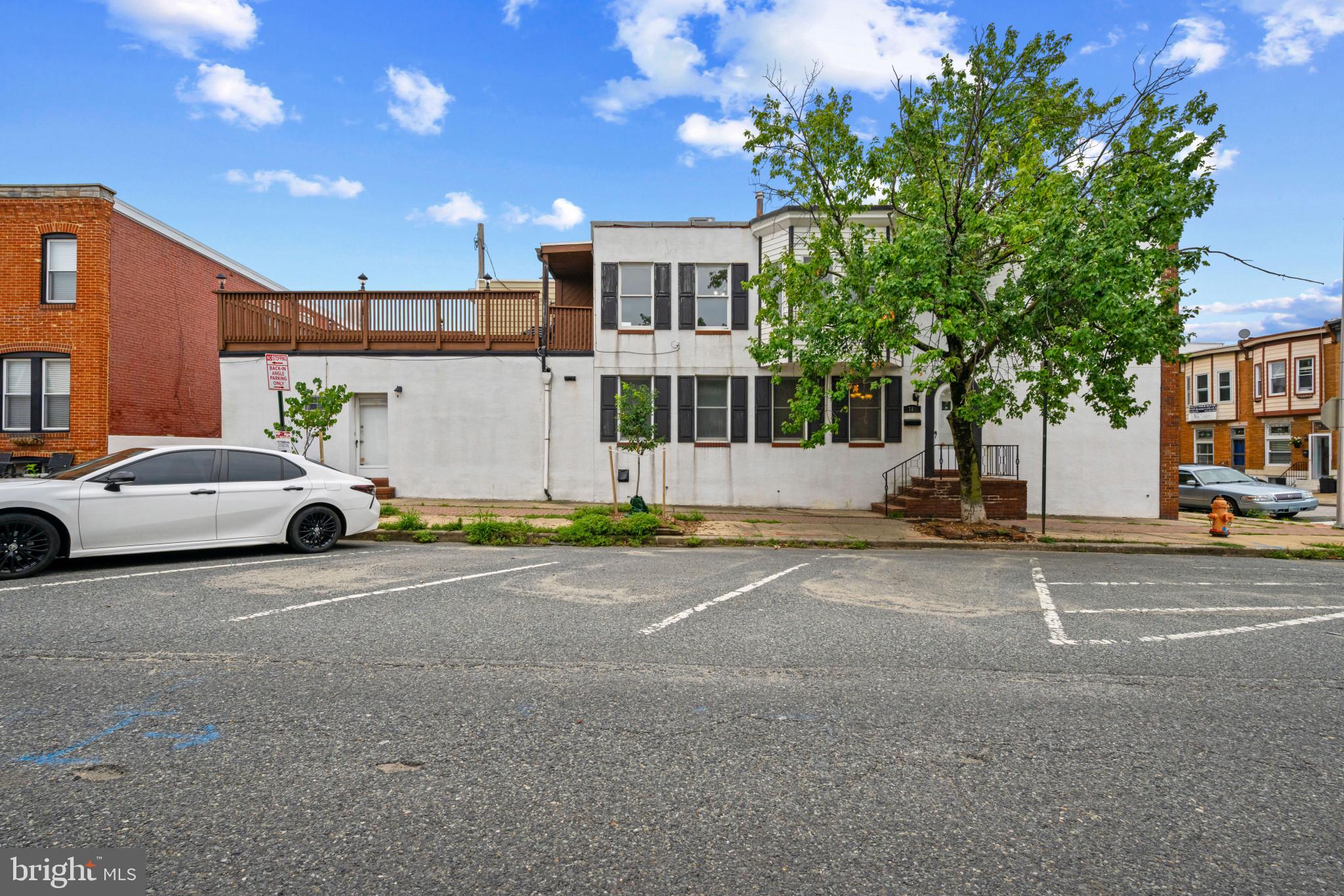 Welcome to this exceptionally spacious end-of-row home in the heart of Canton, where classic European charm meets modern convenience. Featuring 2 bedrooms, 1.5 bathrooms, soaring high ceilings, and abundant natural light throughout, this home offers a warm and inviting atmosphere with timeless character. The main level includes a convenient first floor laundry area and half bath, along with an expansive rear bonus living space complete with a wet bar. This versatile area is perfect as a second family room, entertainment space, home office, gym, or playroom. The possibilities are endless! The finished basement provides even more flexible living space, ideal for a home office, den, or hobby room. Upstairs, you'll find a generously sized primary bedroom with direct access to an impressive 12' x 18' private deck; perfect for relaxing with family, entertaining friends, or enjoying your morning coffee. A second spacious bedroom and full bath complete the upper level. Situated in one of Baltimore's most sought-after neighborhoods, this home is just steps from Canton's vibrant restaurants, bars, boutiques, and shops, with Patterson Park only a short stroll away. Experience the best of city living while enjoying the space, character, and versatility this exceptional home has to offer.
