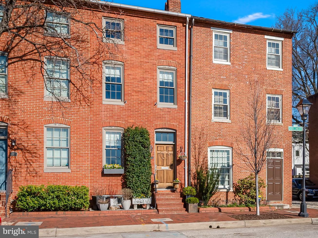 Welcome to this enchanting and tastefully renovated Otterbein home, offering a clean, contemporary aesthetic while maintaining its warmth and historic charm. 609 S. Sharp Street is one-of-a-kind, so be prepared to fall in love. Offering three levels of bright, fully renovated open spaces, this 2 bedroom, 2 full-bath home feels spacious and inviting at every turn. 

Enter through the living room and adjoining dining room area, adored by a fireplace, an exposed brick wall, and illuminated by the 3-story atrium-style windows that flood the home with natural light.  Your eyes will immediately be drawn to the beautiful and uniquely remodeled kitchen, which features soapstone and stainless steel counters, ample cabinetry and built-ins, a Smeg gas range with a rangehood, Fisher and Paykel 2 double dishwashers, a built-in beverage fridge, a large stainless steel farmhouse style sink, reclaimed wood wall shelves, and lovely glass tile backsplash. French doors off the kitchen open to an inviting, fenced, bluestone patio and rock garden that backs to Concert Park, one of Otterbein’s most beautiful parks.

A custom, contemporary staircase with steel railings leads you to the light-filled, open second level. The versatile office/den area features a vaulted ceiling and a large skylight that streams natural light from the 3rd level. The second-floor bedroom has beautiful original heart pine floors, a decorative fireplace, and an exposed brick wall. You'll appreciate the vanity area and a large walk-in closet outside the bedroom. The remodeled full bathroom features a walk-in shower, heated floors, and a heated towel rack with sunny Eastern views overlooking Concert Park.  A convenient laundry room, rarely found in homes like these, features a front-loading washer and dryer, extra storage space, and so many built-ins and storage options. 

Continue to the bright 3rd level, where you’ll find the loft-style primary bedroom overlooking the 2nd level with a large skylight overhead, exposed brick wall, and another large walk-in closet. The remodeled ensuite bathroom has a glass shower, freestanding soaking tub, and towel warmer.  You’ll feel as if you entered a beautiful spa!

Importantly, this great Otterbein location offers ease of parking (Area 8, permit only!) and an excellent east/west orientation, providing the best settings for sunny mornings and cooler evening entertainment on the rear patio and gorgeous sunrises and sunsets.  Significant enhancements in the last 10 years include an updated A/C system, double pane replacement windows throughout the home, and new flooring and appliances throughout.  Last but not least,  a coveted transferable membership to the Otterbein Swim Club enables the lucky owner to bypass the multi-year waiting list. Otterbein is a perfect neighborhood for those who appreciate beautiful architecture and multiple pristine parks.  A stone’s throw from two major league stadiums, the Inner Harbor, restaurants, and the Marc Train and I95 for easy commuting.