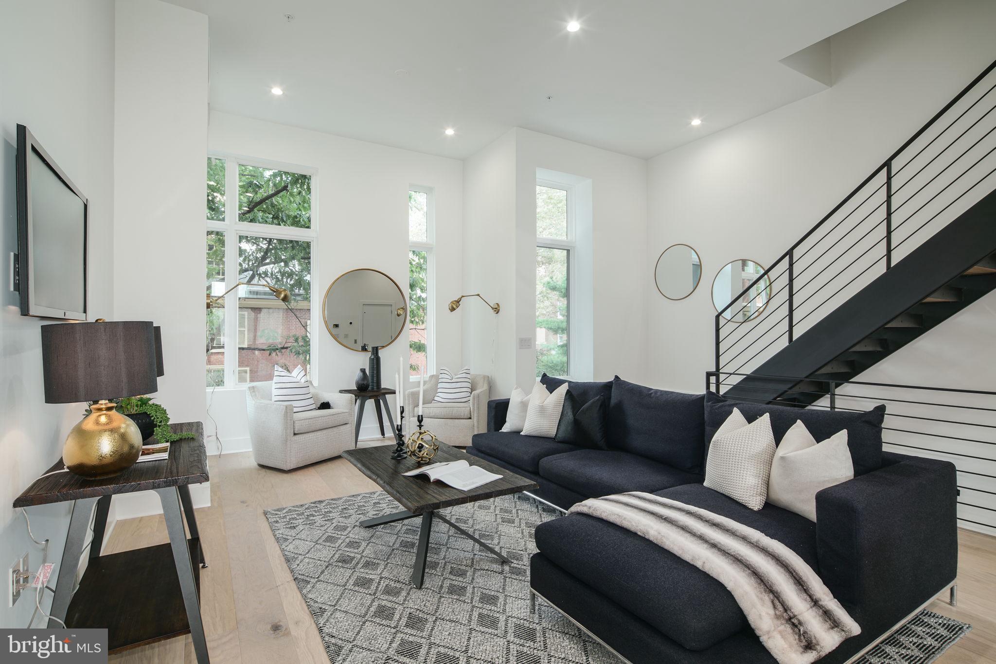 Welcome to the fully loaded home at Lippincott Alley.  Lippincott is a premier living destination in the heart of Old City. Located next to the historic Arch Street Meeting House, the townhomes at Lippincott provide a sanctuary from the bustling pace of life in the city. Enter your front door from a quiet, brick-paved lane and step into a home that is refreshingly contemporary or enter from your 2-car GARAGE! Enjoy an open concept main level floor plan that is perfect for entertaining. Relax and unwind in the comfort of the living room. This light-filled space highlights the natural beauty of the surrounding landscape. Cooking won't feel like a chore in this gourmet chef's kitchen equipped with Wolf and Sub-Zero appliances, granite countertops, plenty of cabinets for storage and direct access to your private balcony. The second floor features two large bedrooms with custom walk-in closets. Each bedroom has its own bath - one with a tub/shower combo, the other with a glass-enclosed shower. A bonus feature of the space includes upper-level laundry with Whirlpool front loading washer and dryer. Pamper yourself in the master suite. Enjoy a generous walk-in closet with custom storage system and spa-like master bath featuring a double vanity, free-standing soaking tub, large glass-enclosed shower with multiple shower heads and rain shower plus tons of natural light. A private elevator whisks you up to the roof deck where you can enjoy the view and watch the fireworks at Penns Landing. The pilot house is equipped with open shelving and lounge area - plus a powder bath. Leave the car parked in your private two car garage. Enjoy the ease of being within walking distance to the best of Old City - located just minutes from public transit, the city's best restaurants, boutique shops, art galleries and area attractions. Additional features of this 3-4 bedroom, 4 full and 2 powder bath home include include a finished basement with a full bath, flex space for a 4th bedroom and extra storage, gorgeous hardwood floors and tile throughout, high ceilings, alarm system, and several years remaining on the tax abatement. Luxury living in one of the most historic locations in the US. What more could you ask for? Schedule a showing today. All square footage numbers are approximate and include above and below grade measurements. Square footage should be verified by the buyer. It is the responsibility of the buyer to verify real estate taxes. HOA fee does not include flat rate for monthly PRIVATE trash $24. Rooftop kitchen and wetbars in home are not included, they are upgrades. Pictures are of the upgraded model home.