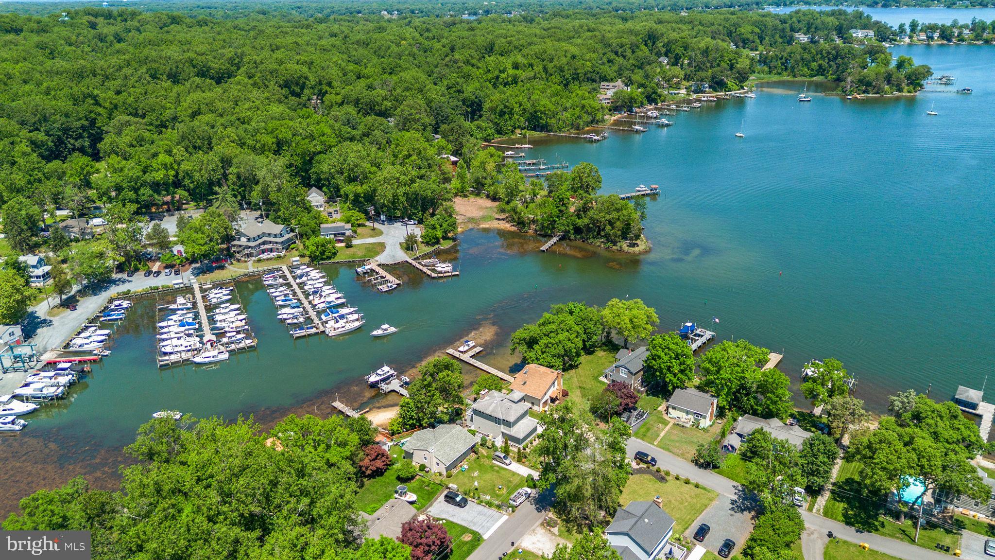 COMING SOON in Palisades on the Severn! Welcome to this charming waterfront retreat perfectly positioned along the shores of Browns Cove with breathtaking panoramic water views from nearly every window. Originally built in 1940 and thoughtfully renovated in 2008, this contemporary home seamlessly blends timeless character, modern comfort, and an unparalleled waterfront lifestyle.
Offering 2 bedrooms, 2 full bathrooms, and over 2,000 finished square feet, the home features an open-concept main level designed for effortless everyday living and entertaining. The spacious living room flows seamlessly into the kitchen, while a separate dining room provides the perfect setting for gatherings. Walls of windows throughout the home fill the interior with natural light and frame the stunning marina and river views. Beautiful hardwood and carpet flooring, along with two cozy fireplaces, create a warm and inviting atmosphere.
The main level includes a comfortable bedroom and full bath, while the entire upper level is dedicated to an exceptional primary suite. This private sanctuary features a spa-inspired bathroom, dual walk-in closets, a sitting area, and a private deck overlooking the water—an ideal place to enjoy your morning coffee or unwind at sunset. An upper-level laundry area adds everyday convenience.
Outside, enjoy direct water access from your private dock equipped with an electric boat hoist/lift, along with riparian rights and navigable water access right from your backyard. Whether you're an avid boater or simply appreciate life by the water, this property offers a rare opportunity to embrace the Chesapeake Bay lifestyle.
Residents of Palisades on the Severn enjoy an array of community amenities, including beaches, a boat ramp, and playgrounds. Combining serene waterfront living with easy access to shopping and dining, this special property offers the perfect place to call home!