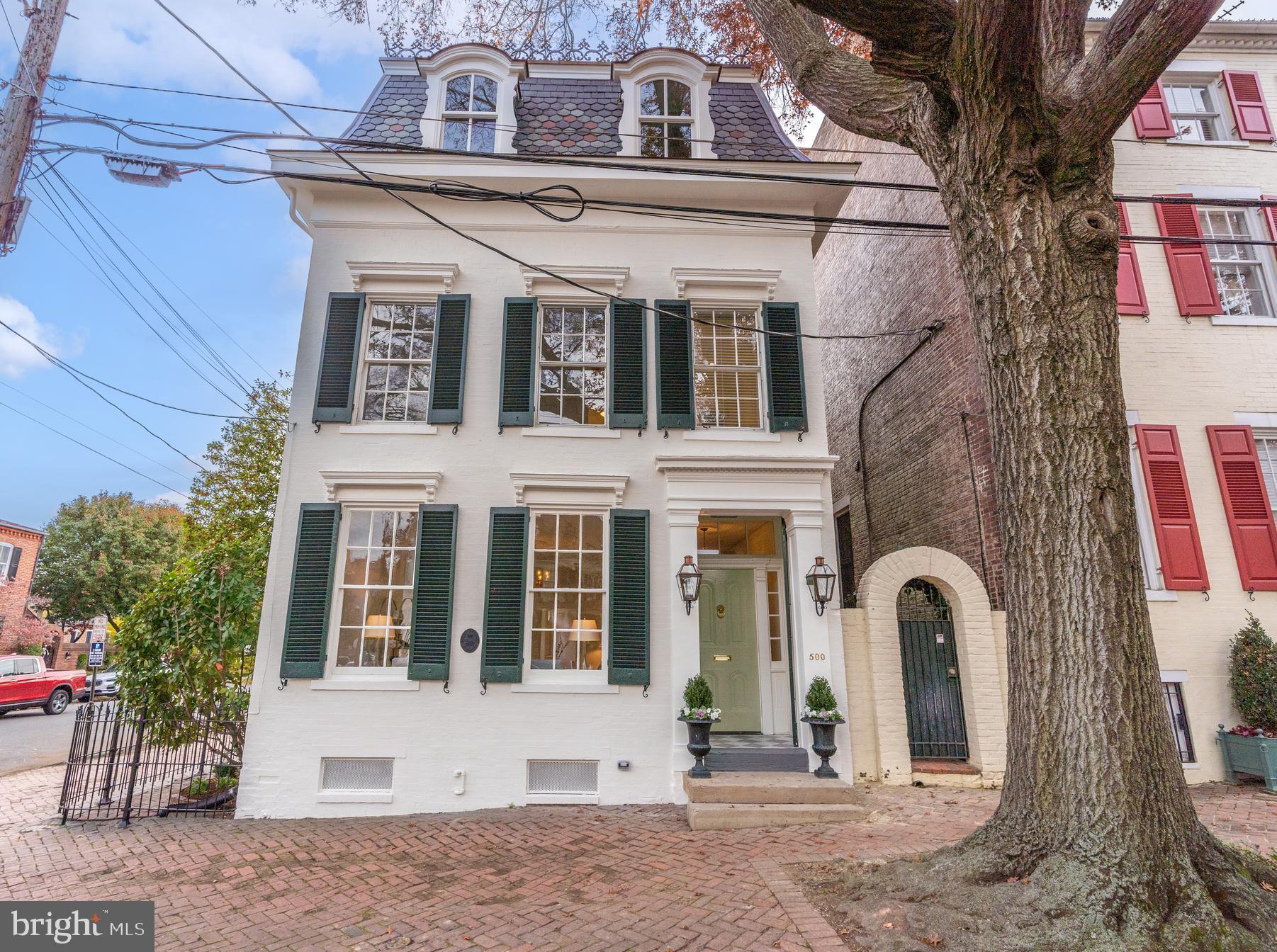 Circa 1840 Victorian gem has been masterfully reimagined by architect Val Hawkins.  Located in the southeast quadrant of Old Town Alexandria, this exquisite home has been fully restored and is ready for the most discerning buyer.   Beyond the original heart pine floors, millwork throughout the home was custom designed and expertly installed.  The double parlor features high ceilings, a spectacular bay window and rebuilt wood burning fireplace.  A spacious formal dining room has patio access and the home’s second wood burning fireplace.  The heart of the home showcases a chef’s kitchen with Bluestar gas range, Dacor refrigerator, wine refrigerator, two Asko dishwashers and a custom built-in banquette with additional storage.  The adjoining family room offers direct access to the brick-walled patio.  Beyond the family room is a full bath and stairs leading to a private retreat, perfect for a home office, guest suite or fifth bedroom.   Ascend the main staircase to the elegant master suite which features an en suite bath with freestanding soaking tub, double vanity, spacious shower and separate dressing area. The upper level offers three additional spacious bedrooms and two full baths.  Luxurious details throughout the home include Waterworks fixtures and tile, marble and soapstone countertops and antique and designer lighting.  This detached home offers windows on four sides and is flooded with natural light throughout the day. With all new plumbing, electrical, HVAC systems and roof this is truly a move-in ready, forever home!
