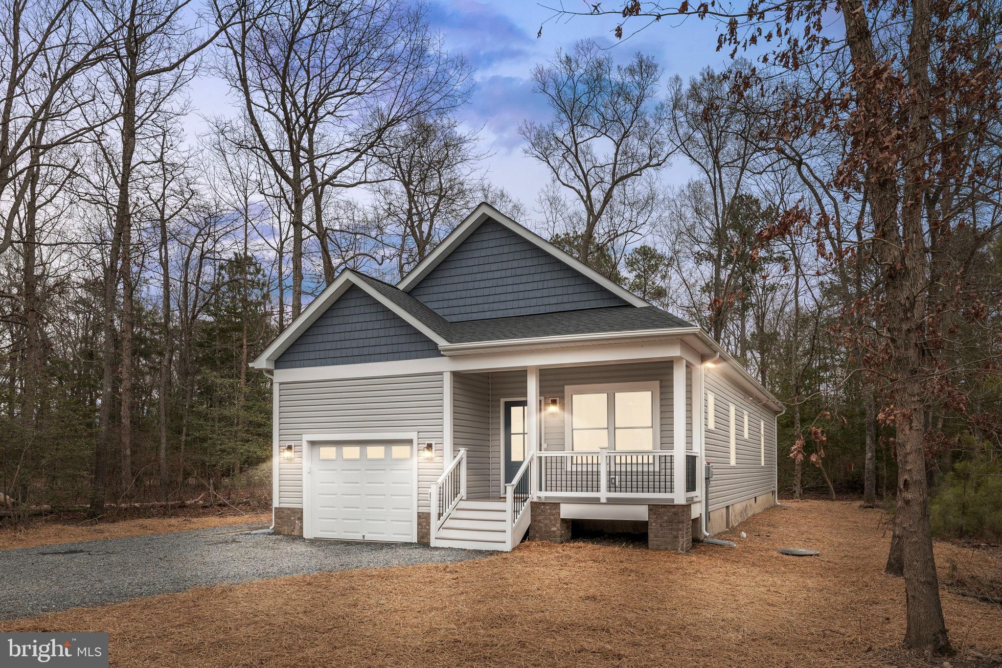 Stunning new construction in charming Colonial Beach!  Move in ready!  

Discover quality craftsmanship and thoughtful design in this brand-new 3 bedroom, 2 bath home, built by a renowned Northern Virginia custom builder known for superior materials and attention to detail—no builder grade here!  It's all in the details.

Step into the open living area with vaulted ceilings, creating a bright and airy space perfect for entertaining. The gourmet kitchen impresses with a  walk-in pantry, quartz countertops, soft-close cabinetry, Samsung stainless appliances, and stylish accessory lighting. Durable and luxurious 3/8-inch cork-backed LVP flooring runs throughout.

The primary suite offers a peaceful retreat with a tray ceiling, spacious layout, and a tiled ensuite bath featuring a  tiled walk-in shower and modern finishes. Two additional bedrooms and a second full bath also include tilework and upgraded trim.

The fully finished garage is large enough for both a car and a golf cart, and features an aluminum-insulated door. Outdoor living is just as impressive with an 18x6 back porch (timber tech) and TimberTech front porch and rail, complete with recessed lighting for evening ambiance.

Additional upgrades include:

Double-hung vinyl windows with aluminum-wrapped exterior

All-wood interior trim

Timberline 50-year architectural shingles with extended warranty.

Accessory lighting in kitchen and baths

Schluter waterproofing systems with a lifetime warranty (as certified installers)

 A 1-2-10 year warranty to give homeowners peace of mind.
1 year workmanship
2 year electrical plumbing hvac 
10 year foundation. 

48 inch deep foundations which more than double the county requirement to ensure stability.

 Don't miss this rare opportunity to own a high-quality, custom-built home that stands out from the rest.
Ask about preferred lender.