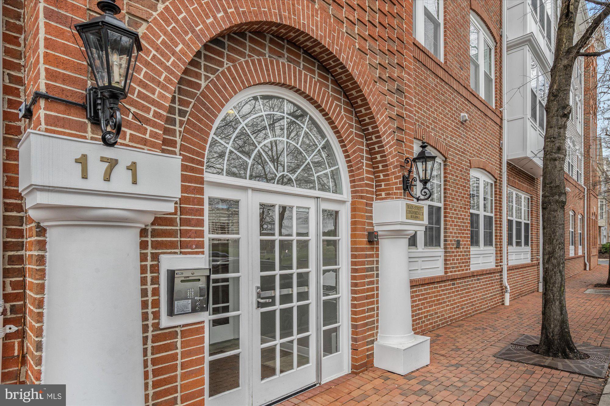 Rarely available in Main Street Condominium floor plan, beautiful sun filled condo with plush carpets, fresh neutral paint, upgraded bath, recently replaced HVAC system and water heater,  gas fireplace and spacious balcony . One reserved parking space in garage and one reserved outside!  Great location across the street from Brenman Park and just minutes away from all Cameron Station amenities. Please visit!