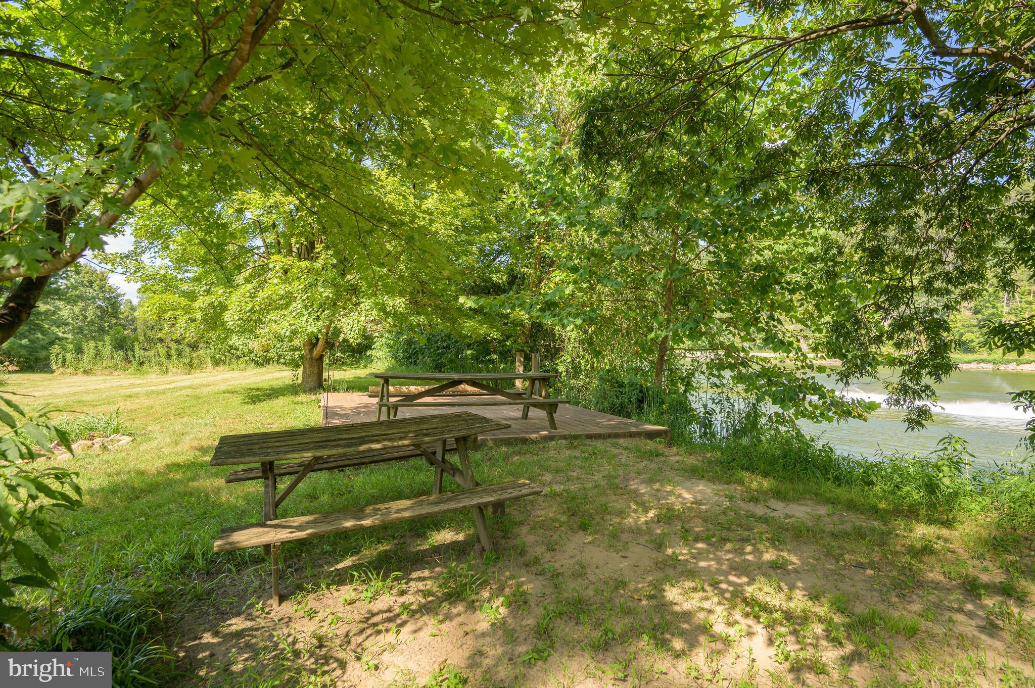 Discover a unique opportunity to own 5.01 acres of private, wooded paradise along the deep water section of the Potomac River. This exceptional riverfront property offers 30 feet of depth directly in front of the dock, making it ideal for large boats, fishing, or recreational watercraft.
Located on a quiet, paved private road, the lot features a solid-base gravel driveway leading to a cleared homesite surrounded by mature trees. Enjoy panoramic views of the historic C&O Canal Towpath, just across the river, with unparalleled privacy and serenity. This is a rare combination of deep water access, natural beauty, and development-ready infrastructure in a highly sought-after location. Don’t miss your chance to own a premier piece of Potomac Riverfront land.  Schedule your private tour today.