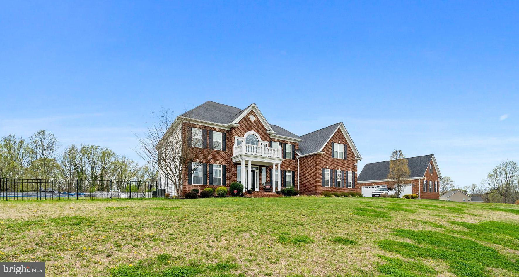 Coming Soon, QBHI's Grand, Brick front Westminster in the sought after The Lakes at Twin Shields neighborhood. This was the decorated model for this neighborhood and has so many extra features offered throughout this home.  Enter into the 2 story foyer with beautiful staircase will impress everyone! Features include a formal living and dining rooms, study, 16x16 sunroom that leads to the maintenance free decking, grand kitchen with HUGE Island, double ovens, gas cooktop, pendant lighting and opens up to the kitchen table space area and 2 story family room with gas fireplace.  Upstairs has a large owners suite with tray ceiling, sitting room, amazing bathroom with luxury cabinets, separate vanities, and pedestal tub. All this plus a custom owners closet with built in cabinets.  Bedroom 2 has it's own full bath, large bedroom 3 and 4 plus laundry on upper level.  The basement has a large gym, media room, entertaining area with wet bar, 9' ceilings, full bath and areaway to the beautiful backyard oasis.  Relax in your private backyard pool, completely fenced in.  All this plus 2 separate 3 car detached garages.  The original floorplan has an attached garage, but this home has extra finished square footage in that area with study/den and open space.  Definitely a must see!! Do not miss this home!!