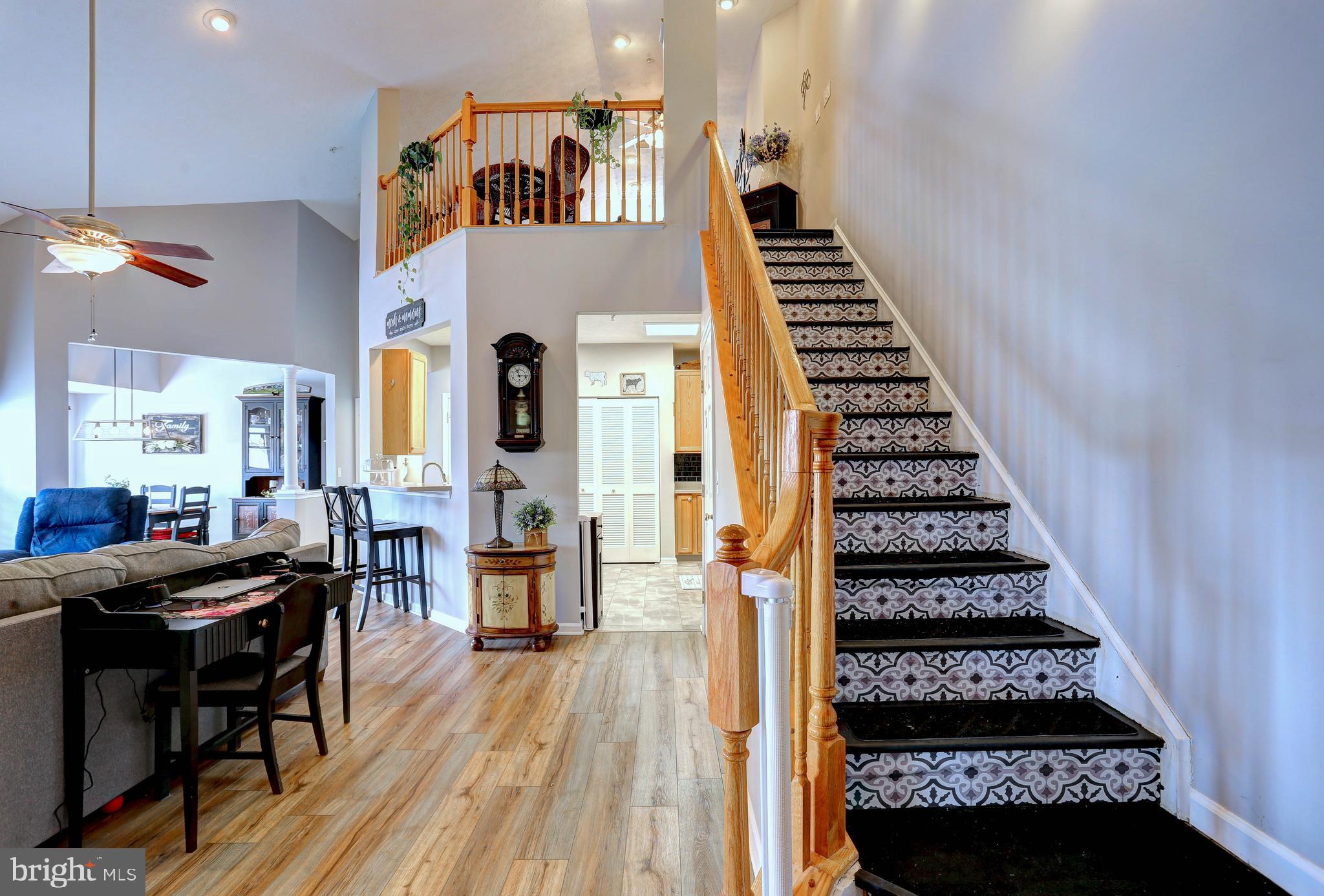 There is much to love about this stylish & sophisticated top-floor 2 level penthouse featuring an expansive loft. Upon entering, you are welcomed with a two story open foyer giving you that spacious feel. This 1,657 sq. ft home has an abundance of natural light pouring in and has been thoughtfully updated. The kitchen boasts new appliances, tile flooring, ample pantry, double sink and a gas stove. Gorgeous new LPV flooring throughout, vaulted and cathedral ceilings, and a balcony to sit outside and enjoy the fresh air. Two generous sized bedrooms and closets with the primary bedroom offering an en suite with a soaking tub and dual vanity. There is also plenty of storage with a large walk in closet near the front door. Laundry is in the unit and the building is secure and has an elevator. One assigned parking spot as well as plenty of guest parking. Close to shopping and dining and The Avenue at White Marsh. You don't want to miss this one!