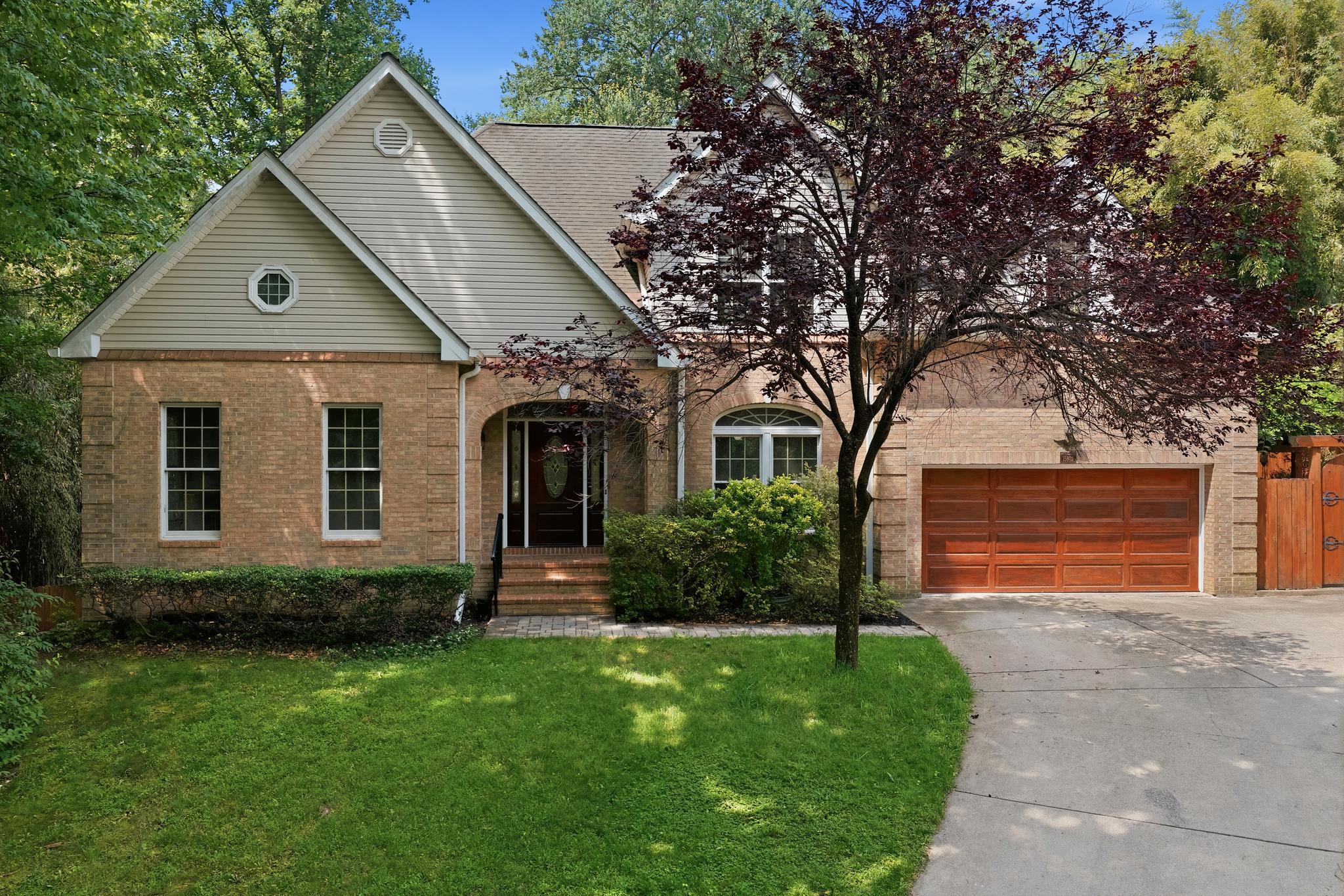 This beautifully maintained and extensively updated home offers exceptional flexibility, luxury finishes, and room to grow with 7 bedrooms, 6 bathrooms, multiple bonus spaces, and a private backyard retreat located minutes from ICC, Glenmont Metro, retail on Rockville Pike, and numerous parks and recreation.

The main level features a stunning 2025-renovated kitchen with KitchenAid appliances, soft-close KraftMaid cabinetry, custom mosaic backsplash, and new flooring. The eat-in kitchen opens directly to the deck, creating an ideal flow for indoor-outdoor entertaining. A cathedral-ceiling family room with wood-burning fireplace serves as the heart of the home, while formal dining and living rooms provide elegant spaces for gatherings, work, music, or quiet relaxation.

The main-level primary suite offers convenient one-floor living and includes a custom walk-in closet and a spa-inspired bath renovated in 2022 with Carrera marble, jetted LED soaking tub, and luxury shower system. Additional highlights include a renovated powder room, vaulted foyer with laser-etched travertine flooring, smart Samsung washer and dryer, custom closet systems, and an oversized two-car garage.

Upstairs are three spacious bedrooms, renovated bathrooms finished in marble and travertine, walk-in closets, attic storage, and a versatile skylit bonus room that easily adapts as a playroom, study area, gaming space, teen lounge, or hobby room.
The walkout lower level expands the home's versatility with three additional bedrooms, including an ideal au pair or in-law suite with private bath. A large recreation room with fireplace, two bonus rooms, and abundant natural light create endless possibilities for multigenerational living, home offices, fitness space, media rooms, crafts, or business storage.

Throughout the home, you'll find fresh paint, hardwood flooring on the main and upper levels, tile flooring in the lower level, no carpet, Andersen replacement windows, Kohler pressure-assist toilets in all bathrooms, and numerous thoughtful upgrades designed for comfort and low maintenance.

Outside, enjoy a year-round private oasis featuring a large deck, flat fully fenced backyard, extensive hardscaping, paver patio, retaining walls, and stone walkways. The spectacular 28-foot pergola-covered lanai draped with mature wisteria is surrounded by established perennial gardens, butterfly gardens, specimen plantings, and tranquil outdoor spaces. A custom Amish-built shed provides additional storage or a private retreat.

The location offers exceptional access to recreation, transportation, and shopping. Nearby amenities include East Norbeck Park with playgrounds, sports fields, and lighted pickleball courts; Adventure Park at Sandy Spring; Northwest Golf Course; Olney Manor Recreation Center; Rock Creek Trail; and Lake Needwood for boating, fishing, hiking, and paddling. Commuters benefit from nearby Metro, Park & Ride access, free RideOn bus service, and direct commuter bus service to the University of Maryland. Dining, shopping, entertainment, and community events are just minutes away in Rockville Town Center and along Rockville Pike.

Combining extensive renovations, flexible living spaces, multigenerational potential, and resort-like outdoor living, this exceptional property offers a rare opportunity to enjoy both comfort and convenience in one of Montgomery County's most desirable locations.