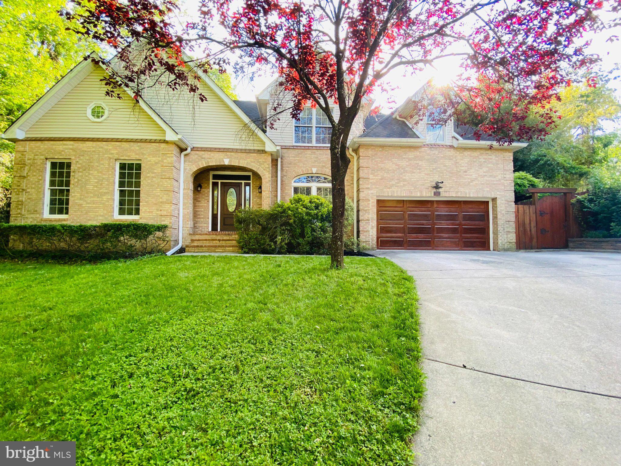 This beautifully maintained and extensively updated home offers exceptional flexibility, luxury finishes, and room to grow with 7 bedrooms, 6 bathrooms, multiple bonus spaces, and a private backyard retreat located minutes from ICC, Glenmont Metro, retail on Rockville Pike, and numerous parks and recreation.

The main level features a stunning 2025-renovated kitchen with KitchenAid appliances, soft-close KraftMaid cabinetry, custom mosaic backsplash, and new flooring. The eat-in kitchen opens directly to the deck, creating an ideal flow for indoor-outdoor entertaining. A cathedral-ceiling family room with wood-burning fireplace serves as the heart of the home, while formal dining and living rooms provide elegant spaces for gatherings, work, music, or quiet relaxation.

The main-level primary suite offers convenient one-floor living and includes a custom walk-in closet and a spa-inspired bath renovated in 2022 with Carrera marble, jetted LED soaking tub, and luxury shower system. Additional highlights include a renovated powder room, vaulted foyer with laser-etched travertine flooring, smart Samsung washer and dryer, custom closet systems, and an oversized two-car garage.

Upstairs are three spacious bedrooms, renovated bathrooms finished in marble and travertine, walk-in closets, attic storage, and a versatile skylit bonus room that easily adapts as a playroom, study area, gaming space, teen lounge, or hobby room.
The walkout lower level expands the home's versatility with three additional bedrooms, including an ideal au pair or in-law suite with private bath. A large recreation room with fireplace, two bonus rooms, and abundant natural light create endless possibilities for multigenerational living, home offices, fitness space, media rooms, crafts, or business storage.

Throughout the home, you'll find fresh paint, hardwood flooring on the main and upper levels, tile flooring in the lower level, no carpet, Andersen replacement windows, Kohler pressure-assist toilets in all bathrooms, and numerous thoughtful upgrades designed for comfort and low maintenance.

Outside, enjoy a year-round private oasis featuring a large deck, flat fully fenced backyard, extensive hardscaping, paver patio, retaining walls, and stone walkways. The spectacular 28-foot pergola-covered lanai draped with mature wisteria is surrounded by established perennial gardens, butterfly gardens, specimen plantings, and tranquil outdoor spaces. A custom Amish-built shed provides additional storage or a private retreat.

The location offers exceptional access to recreation, transportation, and shopping. Nearby amenities include East Norbeck Park with playgrounds, sports fields, and lighted pickleball courts; Adventure Park at Sandy Spring; Northwest Golf Course; Olney Manor Recreation Center; Rock Creek Trail; and Lake Needwood for boating, fishing, hiking, and paddling. Commuters benefit from nearby Metro, Park & Ride access, free RideOn bus service, and direct commuter bus service to the University of Maryland. Dining, shopping, entertainment, and community events are just minutes away in Rockville Town Center and along Rockville Pike.

Combining extensive renovations, flexible living spaces, multigenerational potential, and resort-like outdoor living, this exceptional property offers a rare opportunity to enjoy both comfort and convenience in one of Montgomery County's most desirable locations.