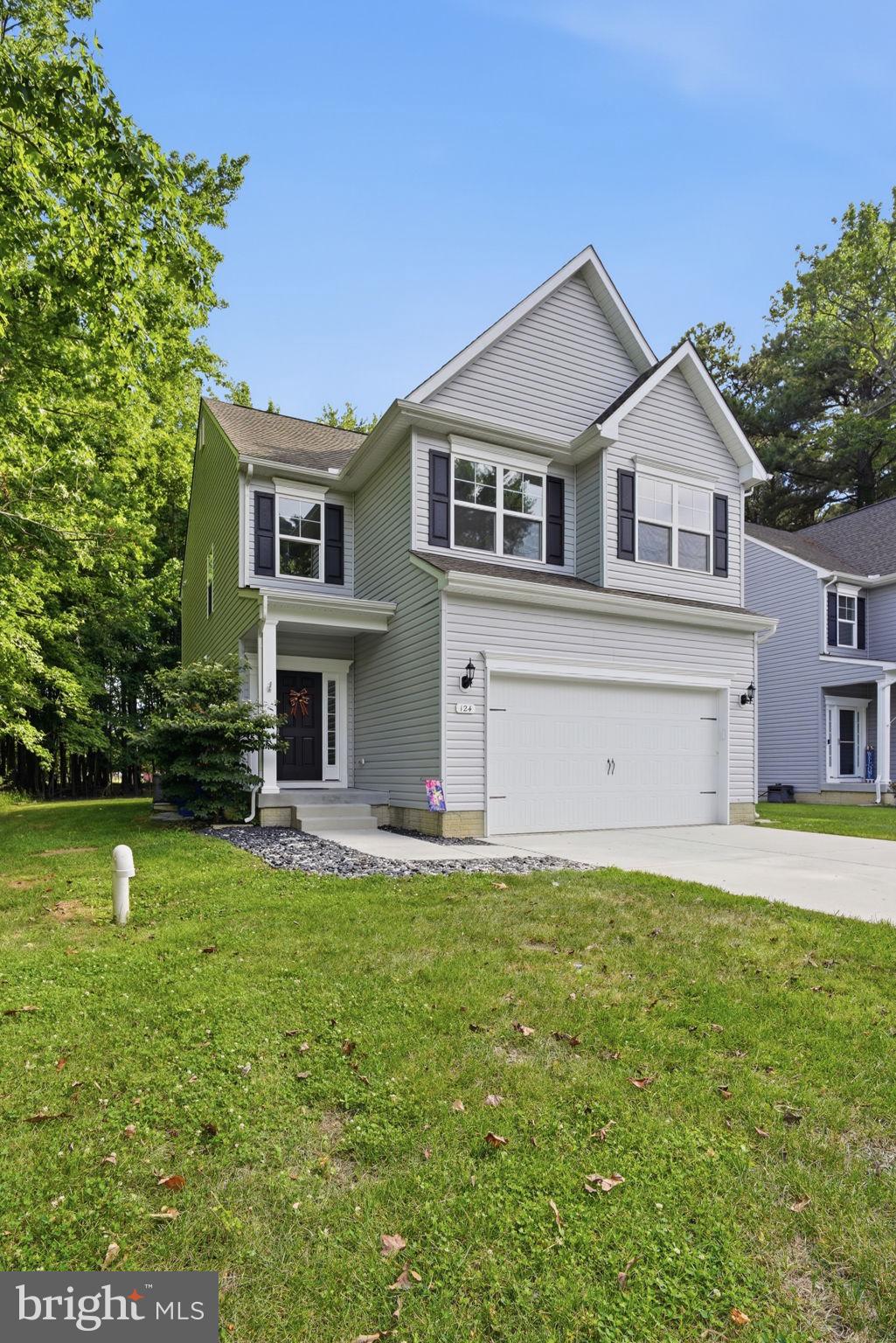 Gorgeous, like-new home on Kent Island! Fresh interior paint and new carpet throughout make this home truly move-in ready. The spacious living and dining areas offer plenty of room for relaxing and entertaining, while the inviting fireplace adds warmth and charm.

The kitchen features a breakfast bar, pantry, abundant cabinetry, and plenty of storage. The spacious owner’s suite includes two walk-in closets and a private en-suite bath, creating a comfortable retreat at the end of the day.

Step outside to enjoy the private backyard backing to trees—perfect for peaceful evenings or outdoor gatherings. Additional features include a water softener and convenient access to nearby boat ramps.

Ideally located close to schools, shopping, golf, pickleball, restaurants, waterfront parks, walking trails, beaches, and local bars. This beautiful home shows exceptionally well and offers Kent Island living at its finest!
virtual staging owner's suite/living room / dining room