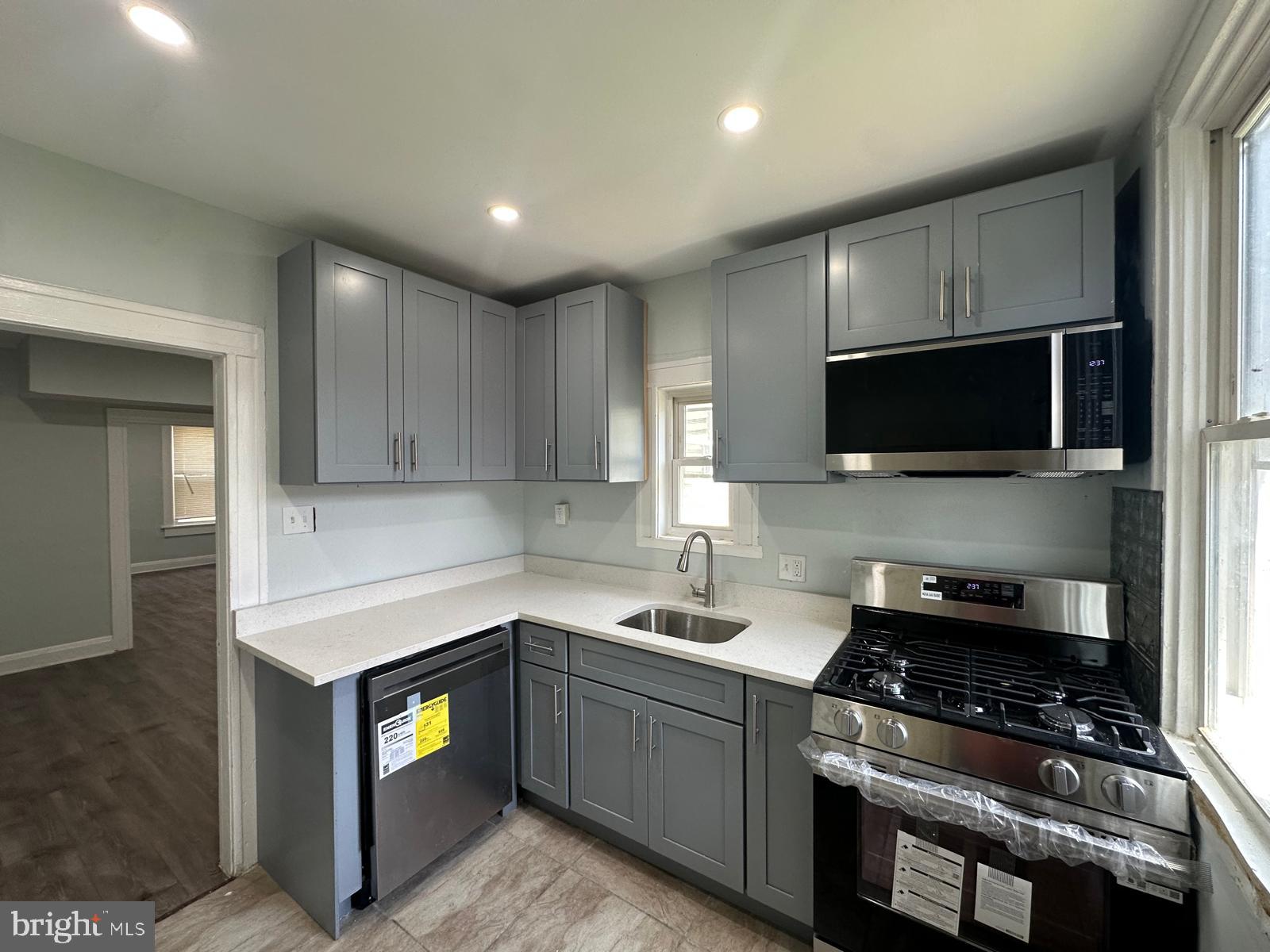 Welcome to this beautifully renovated interior townhome in the heart of East Baltimore! Featuring 3 bedrooms and 1.5 baths, this move-in ready home blends modern updates with timeless charm. Relax on the inviting covered front porch before stepping inside to discover fresh, neutral paint, luxury vinyl plank flooring, and recessed lighting throughout. The stylish kitchen boasts updated cabinetry, sleek countertops, and stainless steel appliances, creating the perfect space for everyday living and entertaining.

Upstairs, you'll find two spacious bedrooms served by a spa-inspired hall bath showcasing a stunning tiled shower. A convenient main-level half bath adds functionality for guests and daily living. The fully finished lower level expands your living space with an additional bedroom and versatile den—ideal for a home office, recreation room, or guest suite.

Outside, enjoy a fenced rear yard with a brand-new deck offering privacy and space for outdoor gatherings, pets, or gardening. Conveniently located near Johns Hopkins University, Morgan State University, Clifton Park, shopping, dining, and major commuter routes, this home provides easy access to all that Baltimore has to offer. Don't miss your opportunity to own this thoughtfully updated home in a convenient city location!