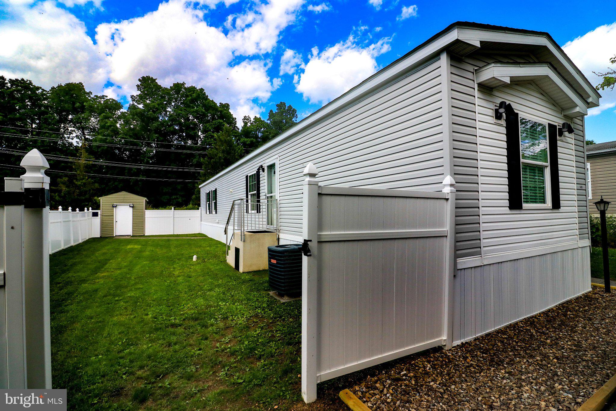 Welcome to this impeccably updated, 2013-built manufactured home offering 1,000 sq. ft. of move-in-ready living space. Featuring a desirable floor plan with a nice flow from the kitchen to the living room, this home offers 2 bedrooms and 2 full, totally renovated bathrooms. The modern interior boasts recessed lighting throughout and new flooring. Outside, you'll find a brand-new walkway, a storage shed, and a fully fenced backyard providing excellent privacy. Combining a newer build with top-to-bottom updates, this home is a rare, low-maintenance find. Schedule your private tour today! Please note this is a personal property sale and Regency Lakes requires application to live in the community. There is a ground lease on the land. Lot Rent: $900 - Criminal Background check required - Credit score minimum - Pet Restrictions - Parking: Each home is issued two parking permits for the lot space and various overflow parking is available. Reach out to listing agent with any questions.